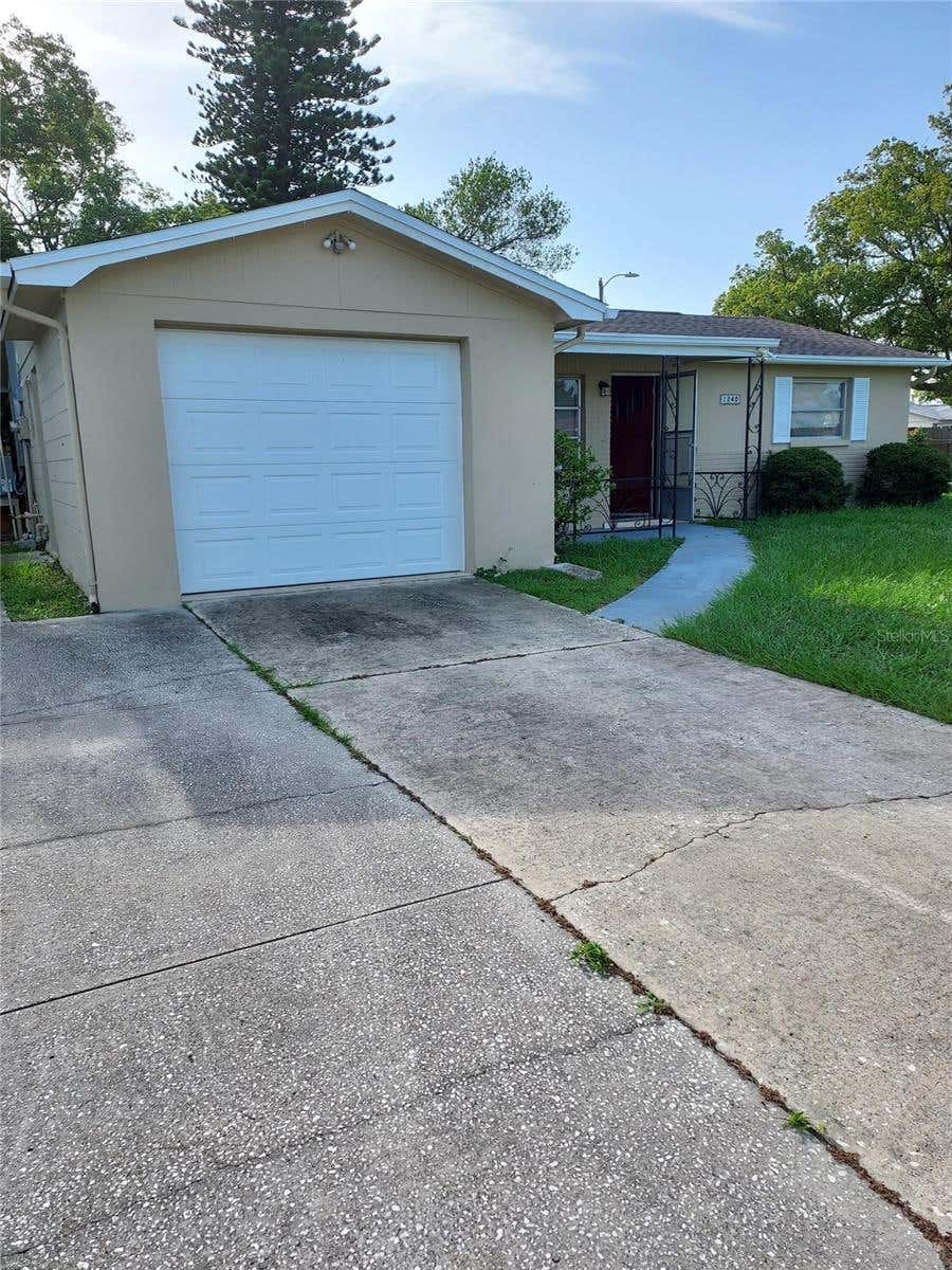 Photo of 1240 Chelsea Lane, Holiday, FL 34691 (MLS # O6415458)