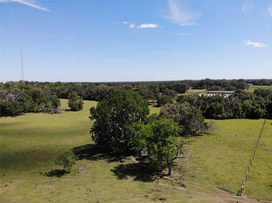 Exceptional vacant land with beautiful rolling hills, a great place for your dream home or ranch. This fully fenced and cleared property features 30.18 acres, providing ample space for raising livestock and creating your ideal equestrian facility, complete with existing animal feed stations. Located just 15 minutes from the popular Ocala Equestrian Center, this property offers a peaceful country setting with nearby stores and entertainment. Don't miss the chance to design your perfect retreat! Schedule your viewing today!
Purchase the adjacent MLS listing O6301292 to acquire a total of40 acres, a house and barn.
