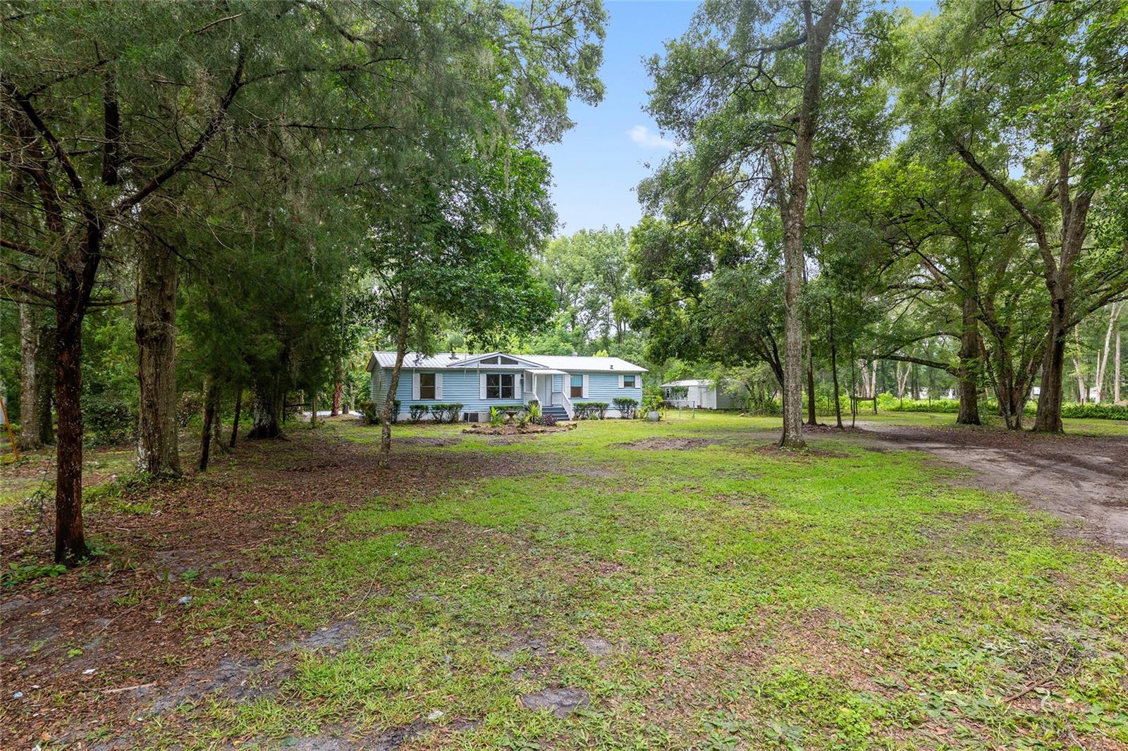 Rare Compound Property! Multi-Generational Opportunity! 3 updated homes on private, 2.18 AG-zone acres with pool! Discover the endless potential of this unique property featuring three move-in ready homes, each equipped with brand-new appliances and flooring. Situated on 2.18 agriculturally zoned acres (AG), the land supports a wide range of uses, including farming, livestock, and horses. A private in-ground pool with new filtration equipment enhances the appeal. The property also includes ample parking, spacious outdoor areas, 4 accessory structures (3 with electric), and an RV pad, perfect for flexible living arrangements. Use the homes for multi-generational living, a mix of owner occupancy and long-term rentals or short-term rentals - the choice is yours. This is a rare opportunity you don’t want to miss. Main Residence 1 - 3 Bedroom 2 Bath & Laundry Room. Home 2 - 2 Bedroom 1 Bath. Home 3 - 2 Bedroom 1.5 Bath. Sale includes two parcels: 41824-000-00 with main home and 41824-003-00 with two additional homes. All homes are individually metered for electric and have individual septic tanks. Seller will consider owner financing.