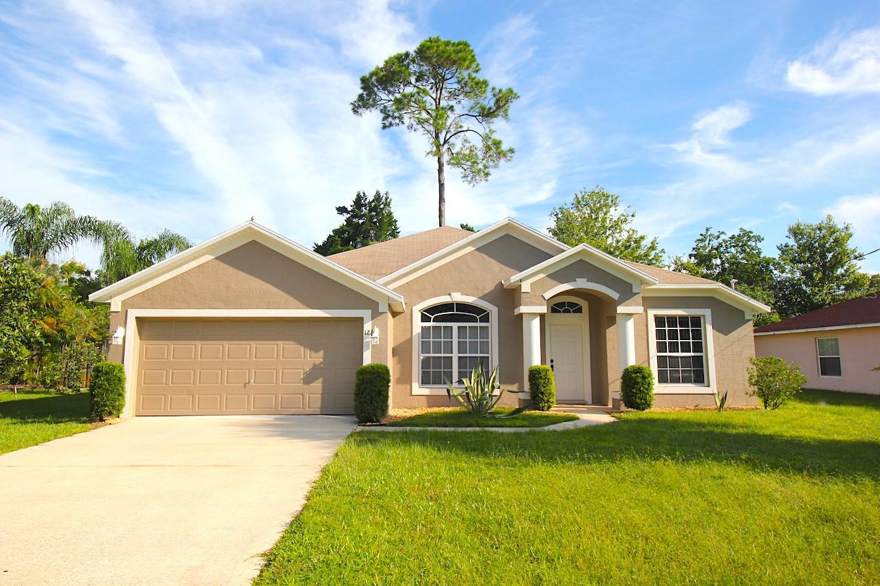 Spacious 4 bedroom, 2 bathroom, 2 car garage home for rent in Palm Coast. This rental features a split bedroom plan, formal dining and family room areas. The open kitchen with breakfast nook offers plenty of counter space and cabinetry. The primary bedroom offers a walk in closet, double vanities, and a walk in shower. The home features tile and carpet flooring in all of the main areas. Enjoy entertaining or relaxing in the covered and screened porch overlooking the back yard. The laundry room accesses the 2 car garage. The house is centrally located with easy access to schools, shopping, entertainment, parks, the town center, and more. Easy access to the main roadways offers a quick drive to the beach. Speedy commute to both Daytona and St Augustine via I95. APPLY TODAY! LBTR#13922