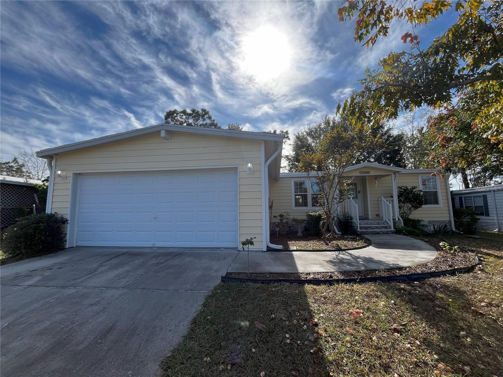 Located in a 55+ community, this beautifully built 3 bedroom, 2 bath one owner home has everything you need to transition to active retirement living. From the moment you enter through the foyer, this home is warm and inviting with its bright natural light and open concept floor plan. A large kitchen and dining area is sure to be where friends and family will gather for a delicious meal. There is no shortage of storage in the kitchen. In addition to the pantry, there are plenty of shelves and custom made full extension pull out drawers. There is also a breakfast bar area right off the kitchen. The primary bedroom is full of natural light and does have an en-suite with a walk-in closet and extra custom shelving. Two additional bedrooms are on the opposite side of the house, along with the second bathroom. Both of these rooms also have custom shelving in the closets. Either room can easily used as a home office, gym or crafting room. Once you step outside onto the custom built deck, you are surrounded by nature. Most homes in the neighborhood have open carports, not this one! This home has a two car garage. The home has been freshly painted and features many upgrades like skylights, reverse osmosis in the kitchen, and LOW HOA Fees! This active community has it all, from an Olympic sized pool to tennis courts, horseshoes and shuffleboard and as well as a clubhouse with daily activities, organized dinners, live shows, bingo, a gym and various clubs to join. Residents can also play a round of golf at the on-site 18 hole golf course. Golf carts are welcome and the community is secure with 24 hour gated access with security guard. The city of mermaids is close by at Weeki Wachee Springs State Park. The Suncoast Parkway is minutes away making transportation to the Southern cities more convenient.