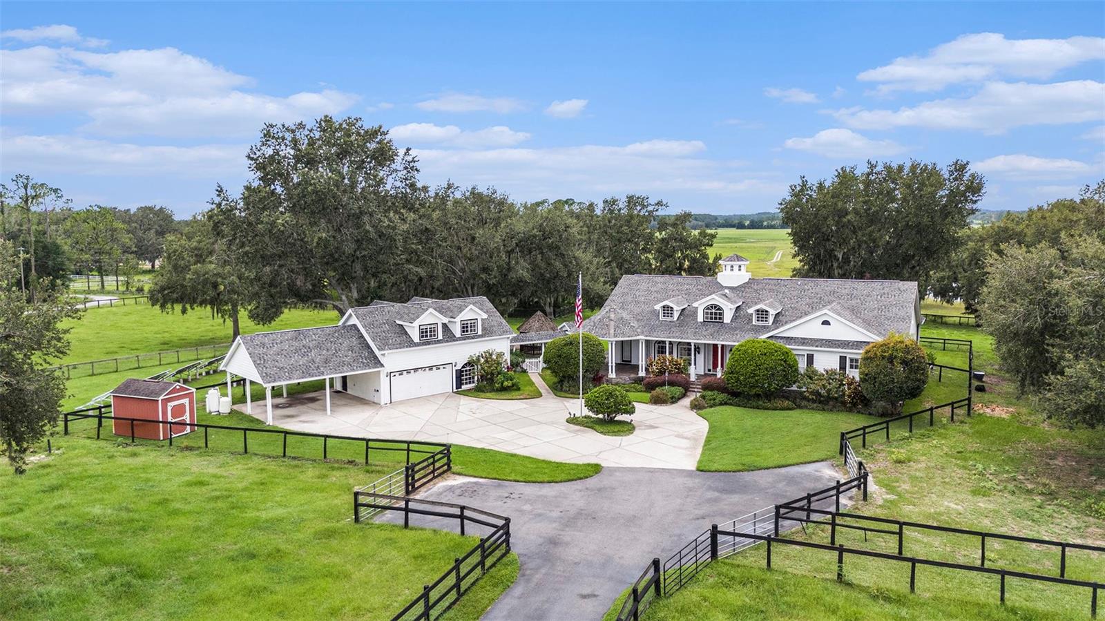 Country Estate with In-Law Suite, Pool, Barns & Solar Panels– A Dade City Dream!
Discover the ultimate blend of luxury, self-sufficiency, and wide-open living in this exceptional estate. Beyond the 3-bedroom, 2.5-bathroom main residence, the property also includes a private in-law suite with an additional 1 bedroom and 1 bathroom with full kitchen downstairs — ideal for multi-generational living, guests, or rental potential. A dedicated cigar and bar room adds a distinctive touch, offering a refined space to unwind or entertain.
Set on beautifully maintained acreage, this solar-powered estate is fully equipped for modern country living. The home features a solar panel system with a 600 amp-hour back up battery. Freshly redone fencing, a private coded gate, and a resurfaced pool (completed 1 year ago) combine comfort with peace of mind.
Inside the main home, vaulted ceilings, granite countertops, stainless steel appliances, and a large kitchen island create an open-concept living space that's both inviting and functional.
Outbuildings and farm infrastructure are thoughtfully positioned and ready for use. The south barn and first north barn are fully powered, while the far barn is prepped for future electric installation. Additional features include five livestock tanks, a 500-gallon propane tank and a 250 gallon propane tank, tankless water heater, property is on septic system, and a private paved road providing secure access to the property.
Whether you're gardening, raising animals, or simply seeking privacy and tranquility, this one-of-a-kind estate delivers space, comfort, and functionality—just minutes from downtown Dade City and the natural beauty of Withlacoochee State Forest.
Schedule your private tour today and experience the freedom of refined country living. Some Photos have been virtually staged.