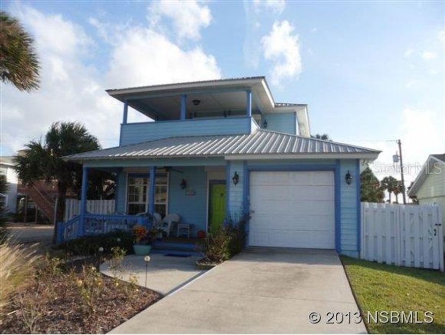 Key West Style pool home only steps to the beach and close to Flagler Ave. shops & restaurants. Built by Hickson in 2004, this fabulous home has 3BR's plus an office area, 2 baths, 1 car garage and a metal roof. Unique features include high ceilings with crown molding & arches, gorgeous wood floors in most living areas and the MBR, plantation shutters throughout & hurricane shutters on all windows. Gourmet kitchen provides an over sized island that seats 8 with granite counter top, extra sink, warming drawer & includes a Stainless Viking 6 burner gas stove & vent hood. Kitchen also features tons of white cabinets & drawers, a walk-in pantry & top of the line stainless appliances. This open floor plan welcomes you with a cozy gas fireplace with stone hearth & mantel, flowing thru to the delightful kitchen & then to the dining room area, and finally opens to a large covered porch. Four antique wood columns separate the kitchen, family room and dining area, providing a very open and inviting atmosphere. Enjoy the breezes & hear the waves from several spacious porches & balconies with beaded ceilings.The tropically landscaped fenced yard includes white vinyl fencing, pavered decks & a Michael Phelps endless pool/spa installed this year. You'll love the master suite on the 2nd floor which includes a luxurious bath with double sinks and his and hers tiled showers. The master bedroom opens to an expansive L-shaped balcony which offers views of the ocean and affords plenty of room for outdoor furniture. Great home for entertaining family and friends. ;Water: City