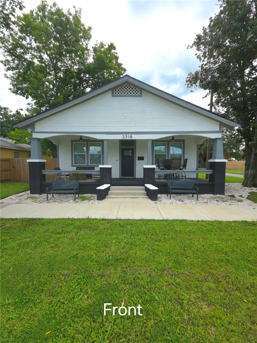 This home’s exterior is almost entirely new, from siding to HVAC to hurricane-proof windows to the roof. The interior is completely new; all appliances, a completely renovated kitchen, living room, bathrooms, and security system. An extraordinary 4-bedroom, 3 full bath, Bungalow home in historic Ybor City! Everything you want is conveniently close by; outdoor recreation is just a 5-minute walk to East Ybor Park, or you can explore the exquisite culture, dining, and nightlife of the Ybor Historic District. Easy access to downtown Tampa, major highways, and local hotspots. This home greets you with premium lighting inside and out, along with the old-fashioned charm of a bungalow. The expansive front porch is complete with two ceiling fans. Once you enter, you are met with an interior completely renovated in 2024 - it's all new! A new kitchen with all new appliances with wrap-around quartz countertops, a quartz-covered island with a new built-in microwave, lighted by an upgraded lighting package, across from a dining area with an upgraded ceiling fan. The flooring throughout the home is beautiful wood-like Luxury Vinyl Panel. The Master Bedroom is adorned with a huge walk-in closet, an appealing dual vanity, a stand-alone deep bathtub that compels you to try it, and a separate glass shower with designer tile. Next, Bedroom 1 is unique in that it features its bathroom with a glass-encased shower. The two remaining bedrooms are new and have been upgraded, featuring a shared bathroom. Finally, there is a large office/multi-purpose room at the rear. The home includes a new washer and dryer. In the backyard, you can host parties, BBQ, or just relax in the huge paverstone-covered Patio surrounded by a new privacy fence, perfect for relaxing or entertaining. This property is ideal for both short-term and long-term investment opportunities. Schedule your showing today.