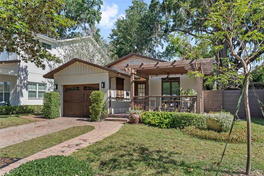 Tucked beneath a canopy of mature oak trees in the heart of College Park, this thoughtfully updated residence blends warmth, character, and exceptional indoor-outdoor living just moments from the shops and restaurants.
Positioned on a charming brick street, this beautifully updated 3-bedroom, 2-bathroom home offers modern functionality and timeless appeal in one of Orlando’s most sought-after neighborhoods.
Inside, vaulted ceilings, skylights, plantation shutters, and rich wood flooring create a bright and inviting atmosphere throughout the main living spaces. The open layout offers exceptional flow between the living, dining, and entertaining areas, anchored by a striking floor-to-ceiling brick fireplace. Expansive windows fill the home with natural light, while the flexible layout provides additional versatility for a home office, reading lounge, or study space.
The renovated kitchen, completed in 2019, features shaker cabinetry, quartz countertops, stainless steel appliances, subway tile backsplash, custom shelving, and an oversized layout designed for both everyday living and entertaining.
The spacious primary suite offers privacy and comfort, while additional bedrooms provide flexibility for guests and family with a full bathroom ensuite. The additional separate flex/workspace adds further versatility for remote work or study.
Designed for seamless indoor-outdoor living, the spacious living room opens to a private paved outdoor seating area framed by mature landscaping. The fenced outdoor space offers multiple areas for dining, relaxing, and entertaining while maintaining both privacy and low-maintenance living.
Additional upgrades include a kitchen extension, HVAC replaced in 2025, recessed lighting, attached garage, brick paver accents, updated lighting and ceiling fans, generous storage, and no HOA.
Located just moments from Edgewater Drive dining, shopping, and entertainment, residents enjoy a 2-minute walk to Publix, a 5-minute drive to Orlando Science Center, 4.6 miles to Rollins College, 5 miles to Baldwin Park, 1.4 miles to Orlando Health Regional Medical Center, 2.6 miles to AdventHealth Orlando, and 17.6 miles to Orlando International Airport.
An exceptional opportunity to own a thoughtfully updated home in the center of College Park.