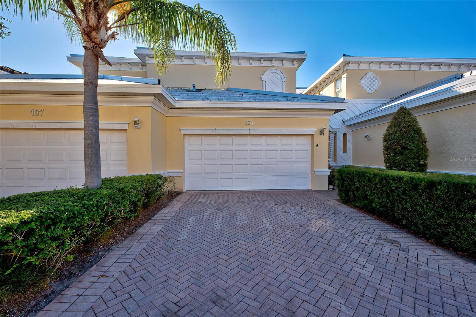 One or more photo(s) has been virtually staged. PRICE IMPROVEMENT! FABULOUS FIRST FLOOR CONDO WITH ATTACHED 2 CAR GARAGE! Welcome to a tranquil oasis at the charming community of Triano! This is a stunning 3-bedroom, 2-bathroom home, complete with a spacious 2-car garage, nestled in a serene setting that overlooks a beautiful pond and golf course. The tranquil environment around the property offers picturesque views, making it an absolute delight for nature lovers and those seeking peace. Imagine waking up to breathtaking sunrises and relaxing evenings with spectacular sunsets, all from the comfort of your expansive screened-in lanai, where waterbirds frequent and the natural beauty of the area is always on display. One of the stand-out features of this home is its impressive floor plan. As one of the largest on the first floor, it provides ample space for both living and entertaining. Whether you are hosting a celebration or enjoying a quiet evening with family, the layout ensures everyone is comfortable and at ease. Your peace of mind is a top priority, which is why the home is equipped with hurricane impact windows and new accordion hurricane shutters. These upgrades provide an added layer of security and protection, allowing you to feel safe and secure no matter the weather. Step into the heart of the home – the kitchen, where newly installed appliances await your culinary creations. The entire interior has been freshly painted, offering a clean and bright aesthetic, while brand-new carpeting in all the bedrooms adds a touch of warmth. The exterior has NEW TILE ROOFS, NEW GUTTERS, NEW PAINT. Every detail has been carefully considered to ensure that this home is truly move-in ready, blending comfort, style, and security seamlessly. The outdoor space is equally impressive, featuring a pool with cascading waterfalls that create a serene and inviting atmosphere. It's the perfect spot to unwind and enjoy the Florida sunshine. For those who prefer a leisurely stroll, the picturesque garden path surrounded by nature's beauty and additional waterfalls offers a peaceful retreat where you can relax and rejuvenate. At the heart of the community lies the elegant clubhouse, a hub for social gatherings and events. Whether it’s a casual get-together with neighbors or a special occasion, the clubhouse provides a welcoming environment for all kinds of activities. Living at Triano means embracing a lifestyle of community, connection, and comfort, where there’s always something happening and opportunities to make new friends and memories abound. Welcome to your new home at Triano, where every day feels like a vacation, and every moment is filled with beauty and tranquility. Here, you can enjoy the best of Florida lifestyle living! Golf, waterfalls, garden walks, resort like community! ADD THIS ONE TO YOUR VIEWING LIST!