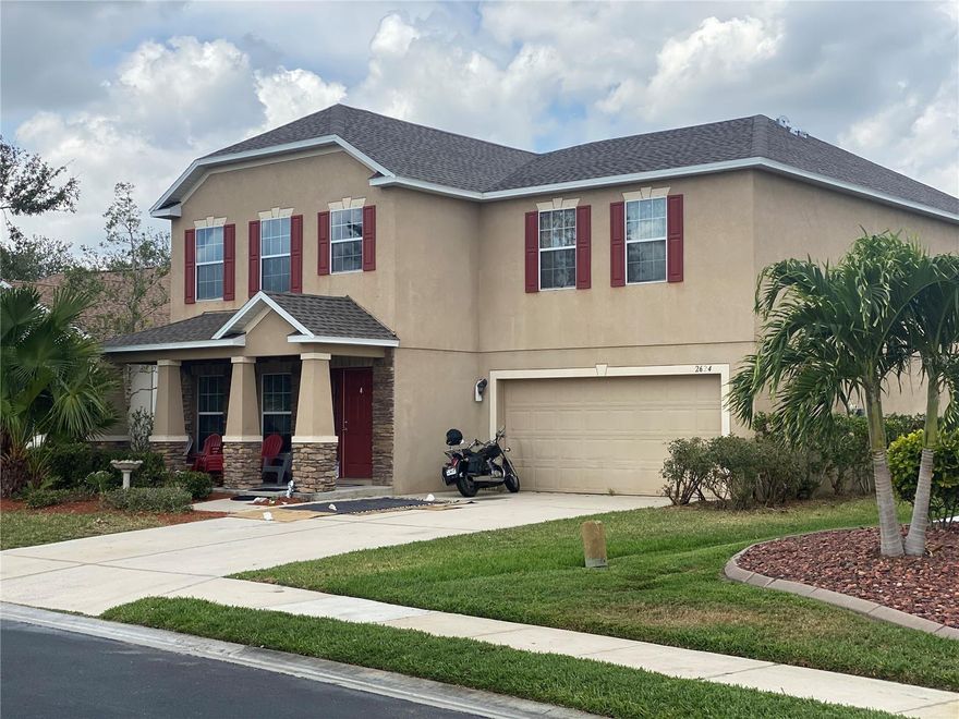 Looking for a well kept and beautiful neighborhood for your family and a neighborhood that will protect the value of your property?  How about a community swimming pool, lots of lakes, picnic area, quiet streets, friendly neighbors, etc.?  Then, Suncoast Lakes should receive a lot of your attention.  Ask your agent for the attached SUNCOAST LAKES HOMEOWNER’S BROCHURE.  5 bedrooms with 4 ½ baths will accommodate any family’s needs, especially when you add in a large living/dining room combo, a spacious great room, tons of kitchen cabinets and countertop space, lots of storage, and the 2nd floor loft.  Don’t need 5 bedrooms?  Just think what a wonderful office or hobby room a large bedroom would make.  The loft and family room give you 2 separate locations to relax and/or watch TV, which is especially convenient if the family doesn’t agree on what to do or watch.  How about a roomy, complete office in the loft?  3 bedrooms have ensuite baths, nice for family and even nicer for overnight guests.  This great setup has one bedroom on the first floor which is very accommodating for those whose climbing stairs days are over (or wish they were over).  Wood cabinets, upgraded granite countertops, and 2 pantry closets make this kitchen a homemaker’s delight.  Much, much more info is attached – ask your agent for copies, especially the FEATURES LIST.  Click the Tour 1 icon above for the NARRATED, VIDEO VIRTUAL TOUR (not just the same still photos)!  This property comes with a ONE YEAR HOME WARRANTY.  The reasonable HOA fee includes all the usual expenditures plus cable TV and irrigation water – big savings.  This property is not in a flood hazard zone and has a NEW roof in March 2023 – more savings. Seller will do no repairs.