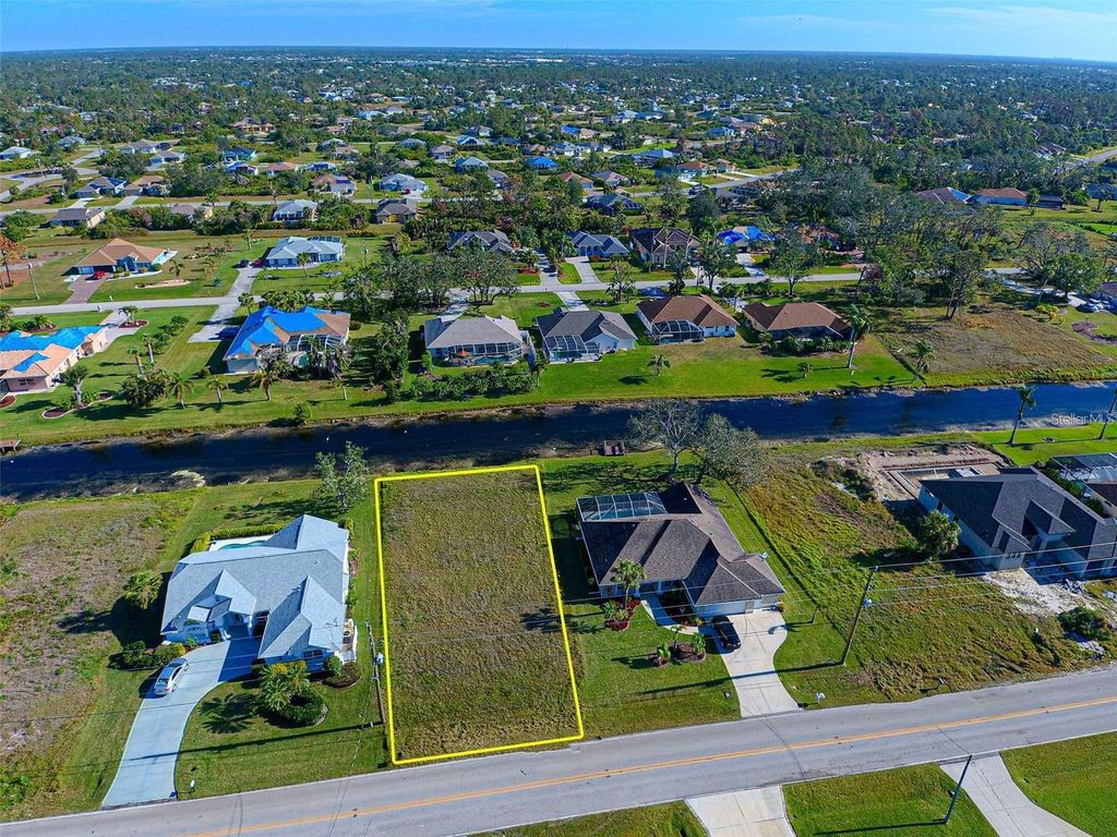 Photo of 687 Rotonda Circle, Rotonda West, FL 33947 (MLS # N6141457)