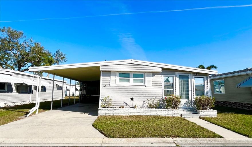 Bungalow style 2 bed 1.5 bath split plan furnished home located in the ONLY Resident Owned Park in the City limits of Sarasota!! 
Plenty of living space with the push out and open Florida room plus a screened lanai for outdoor living space. 
Updates/notes include: Metal Roof Over, Square D Panel, Water Heater newer, updated vanity and stool in main bath, plumbing copper, Sewer line updated, GE Washer newer. Refrigerator not cooling. Soft spots at entrance to front bedroom and at side entrance by refrigerator.
The gated 90 acre community boasts a low maintenance fee with its vast amenities starting with the spacious Clubhouse outfitted with a full commercial cook kitchen, event stage, audio/visual, dance floor, state of the art fitness room, activities hall, library with books/movies/puzzles and a pool table. Outside recreation includes an extra large heated pool with a handicap ramp, a spacious kidney shaped hot tub, ample umbrella tables and lounge chairs and updated shower rooms. Oak trees shade the beautiful park area, picnic tables and a community grill. Additional amenities to enjoy are the community putt putt course, bocce ball, ping pong, horseshoes and corn hole. Oakwood Manor is a vibrant community with numerous social events and activities. Conveniently located adjacent to Legacy Trail and 12 newer pickle ball courts. Just a short drive to our crystal sand beaches, downtown area, the marina, fishing pier, local golf courses, shopping, variety of restaurants, the museum, SRQ airport, SMH and Doctors hospitals. Please note that Oakwood is a 55+, no pet, no motorcycle Park.