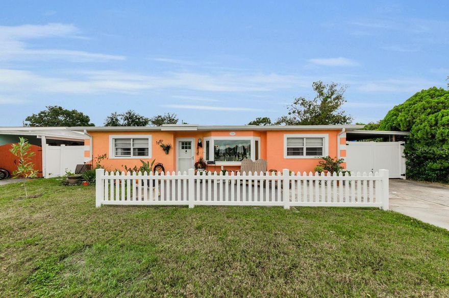 This is a TRULY UPGRADED home just for you! Freshly painted inside and out! The floors have all been replaced. BOTH bathrooms totally upgraded and remodeled , whole house has been re-wired, a NEW electrical box with extra outlets installed. This home is wired for a whole home generator.  There is both a LIVING ROOM and FAMILY ROOM and an absolutely BEAUTIFULL Completely remodeled kitchen!  Gorgeous granite countertops and new cabinets. The kitchen is open to the LARGE Family room and dining area. There is an oversized SCREENED lanai along the entire back of the home. Roof was replaced in 2014, AC replaced in  2017 and water heater replaced in 2021.  The yard is fully fenced and there is a small shed for all your toys or a SHE SHED in the back that matches the home, has it's own electricity and tons of light and sits on a concrete slab.  An extra-long carport runs along the side of the home that will keep all of your vehicles covered. The LOCATION is amazing. Less than 1 mile down the road is the entrance to the beautiful Fred Howard Park and Beach. The park has kayak trails, playgrounds, walking trails, and a causeway out the gorgeous white sandy beach for all of your water activities. This home is just a few steps away is downtown Tarpon Springs where there are monthly First Friday events and many wonderful shops and fabulous restaurants. The FAMOUS SPONGE DOCKS area is only a little over a mile away from this home as well. DON'T WAIT or HESITATE This home in a desirable location will NOT LAST LONG!