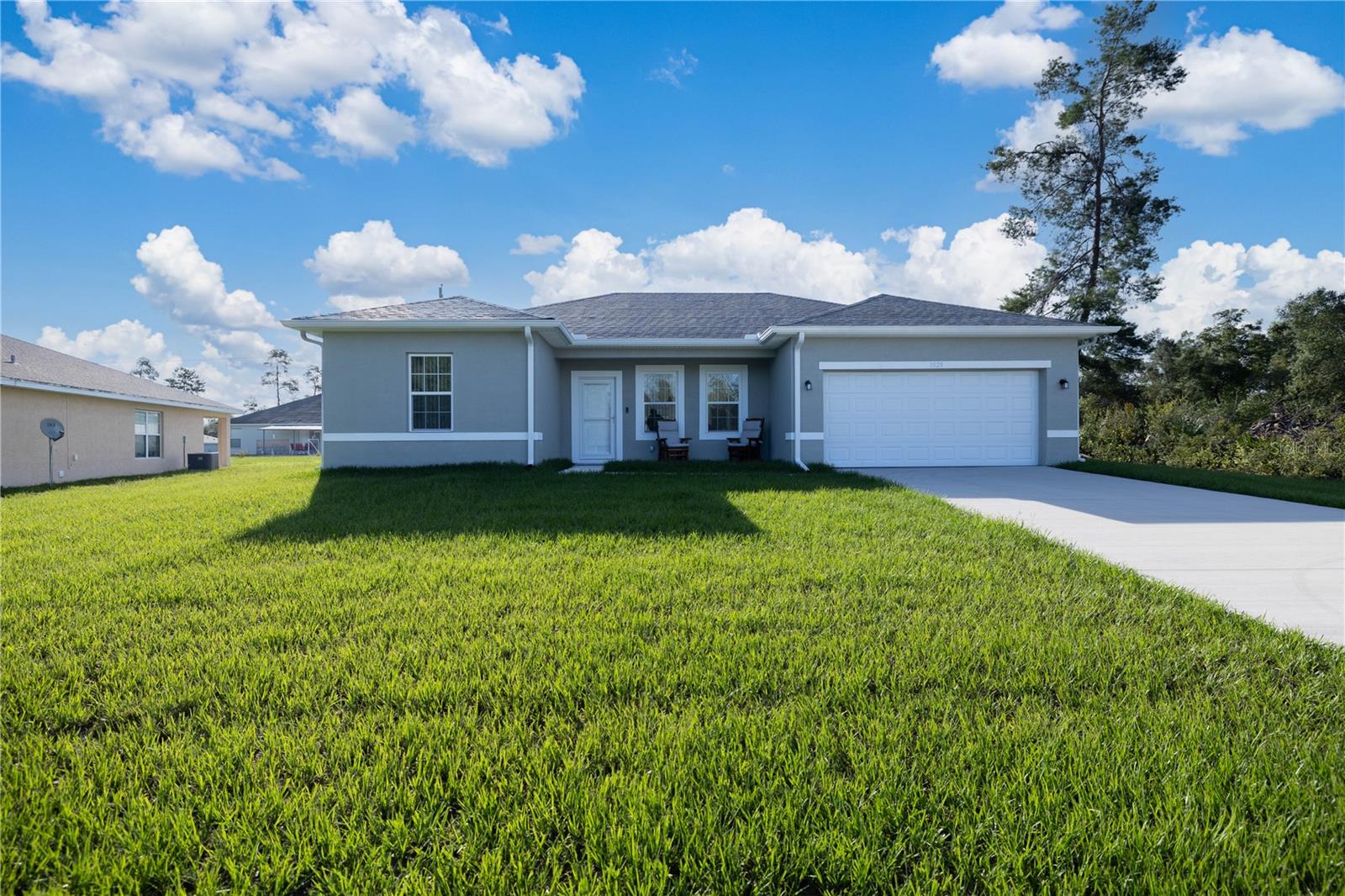 Welcome to this beautifully maintained, nearly-new construction home that combines modern convenience with thoughtful upgrades. This home is move-in ready and packed with valuable additions that set it apart. Enjoy peace of mind with a whole-home surge protector, including coverage for the A/C unit—ideal for protecting your electronics and HVAC system year-round. Inside, you’ll find custom blinds installed throughout, offering both privacy and style in every room. Step outside to appreciate the 8 x 10 storage shed, perfect for tools, seasonal items, or hobbies. The fully fenced backyard features a privacy fence, creating a safe and serene outdoor space. Additionally, gutters have been added, helping protect your investment and improve drainage around the home. This home offers the best of new construction with the benefit of completed upgrades—making it a smart and comfortable choice for any buyer!