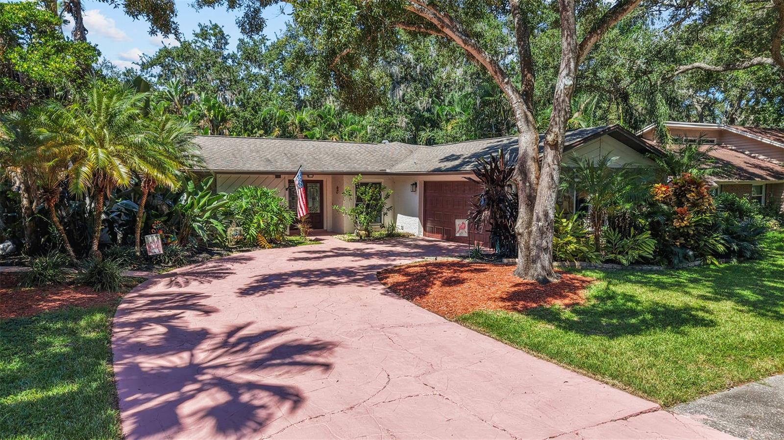 Welcome to Bay Woods in Safety Harbor! Discover this beautifully maintained single-family home offering 1,780 square feet of comfortable living space in the sought-after Bay Woods community. With 3 bedrooms, a dedicated home office, and 2 full bathrooms, this residence is thoughtfully designed to blend functionality with style. At the heart of the home, the kitchen features maple cabinets that add warmth and timeless appeal, opening to the main living areas for easy entertaining. The family room showcases a cozy wood-burning fireplace, creating a perfect spot to gather on cooler evenings. Step out to the expansive 270-square-foot enclosed lanai overlooking the sparkling swimming pool, complete with a screen enclosure for year-round enjoyment. Perfect for entertaining or relaxing in your own private retreat. Whether hosting guests or relaxing in private, this inviting outdoor space is sure to impress. Additional highlights include a 2-car garage and a lush setting surrounded by mature trees and landscaping, adding to the peaceful atmosphere of the neighborhood. Located in charming Safety Harbor, this home is NOT located in a flood zone—no flood insurance required! And this gem is just minutes from the scenic trails and waterfront views at Philippe Park, the vibrant Safety Harbor downtown district with boutique shops and restaurants, popular Gulf beaches, Countryside Mall, and Tampa International Airport—bringing the best of Florida living right to your doorstep. This Bay Woods home combines comfort, convenience, and a serene setting—ready to welcome its next owner. Call today to make your appointment to see this lovely home!