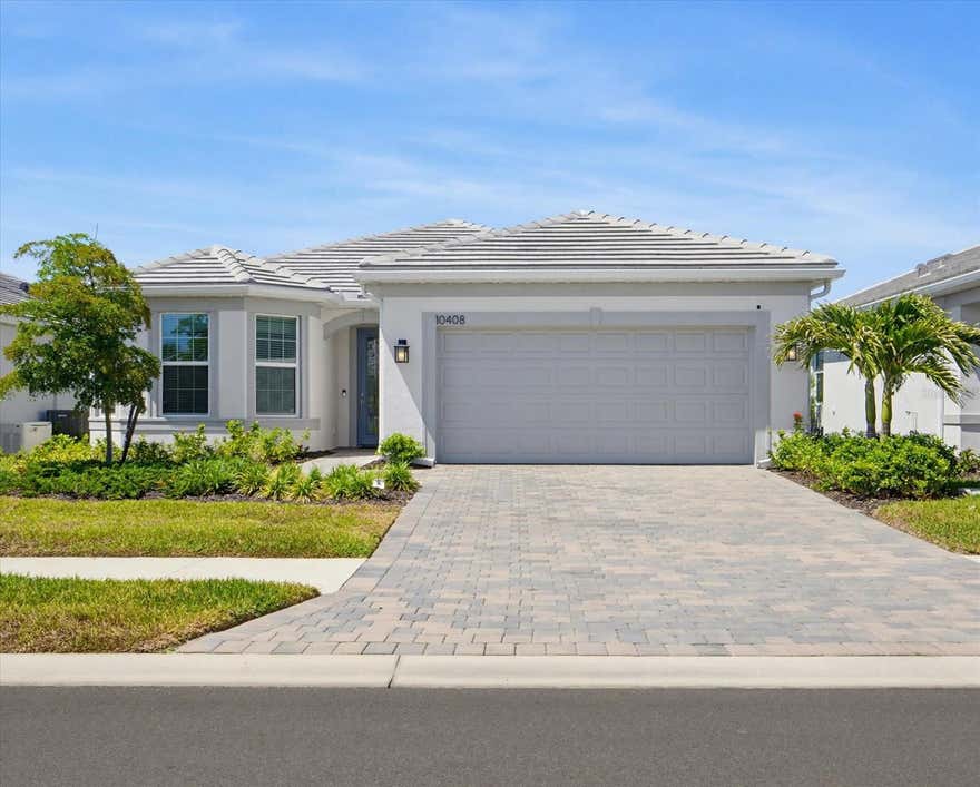 Welcome to this beautifully appointed 3 bedroom 3 bath Mystique model home located ON THE WATER in the highly desirable Beachwalk by Manasota Key community. ONLY 2.5 MILES TO THE BEACH. This thoughtfully designed home offers a bright, open-concept layout that blends comfort, style, and everyday functionality ideal for embracing the Florida lifestyle. CAN BE SOLD COMPLETELY TURNKEY! And have No stress trying to furnish this home. The spacious kitchen serves as the heart of the home, featuring 42' white shaker cabinets, Quartz countertops, center island and modern stainless steel appliances GAS COOKING, all flowing seamlessly into the main living and dining areas. The 8 FOOT EXTERIOR DOORS and Natural light enhances the airy feel, creating a warm and inviting atmosphere throughout. IMPACT GLASS WINDOWS & DOORS. The private primary suite provides a relaxing retreat with a well-appointed bathroom featuring the extra large shower, double sinks and a spacious walk-in closet, while the additional bedrooms and FLEX room living space offers versatility for guests or a home office. EXIT THE ZERO CORNER DOORS TO THE EXTENDED LANAI which adds to the space with indoor/outdoor living in mind. The perfect outdoor space for enjoying morning coffee, evening sunsets, or entertaining friends and family. Enjoy a resort style lifestyle which includes the ON-SITE HIGH TIDE TIKI BAR, the Waterline upscale restaurant (opening in 2026), 21 sports courts for PICKLEBALL, tennis, and bocce ball, a RESORT STYLE POOL with beach entry and attached lap pool, hot tub, amenities center, Cafe', fitness center, boardwalk, Veterans memorial park, community garden, dog park, and miles of trails. The full time activity directors ensure a vibrant and engaging social calendar. Conveniently located near some of Florida’s most beautiful BEACHES, BOATING, exceptional dining, shopping, schools, and endless outdoor recreation. This home offers the perfect blend of luxury, comfort, and location, so don't miss your opportunity to live in Paradise, where everyday feels like a vacation!