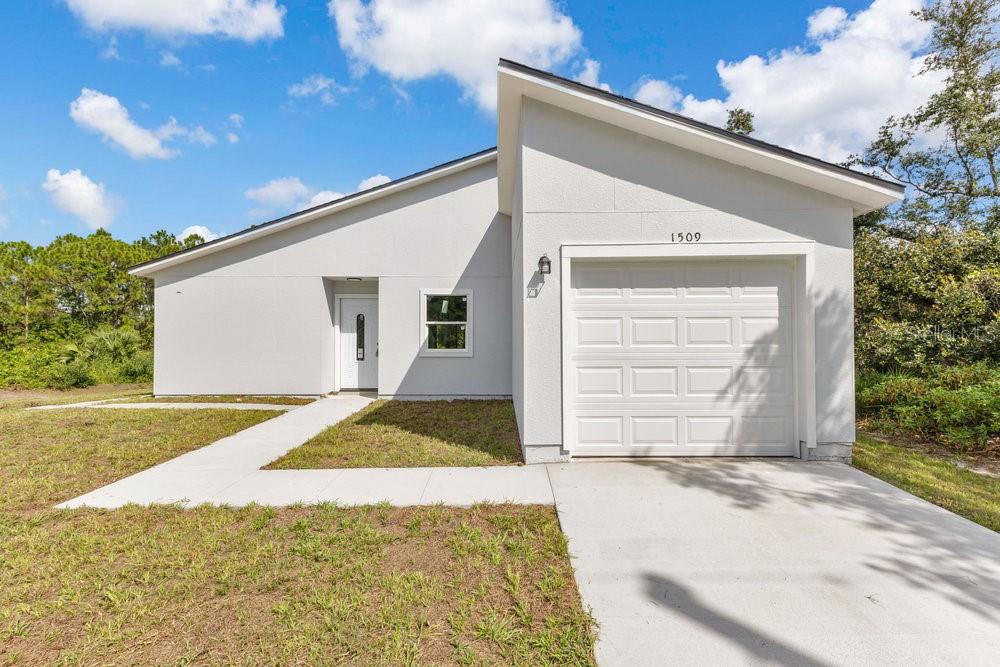 This home offers 2 bedrooms, 1 flex room, and 1 parking space. The layout includes a private side entrance that provides additional versatility in the use of the property. Both the main area and the annex are equipped with a kitchenette, dishwasher, refrigerator, washer, and dryer, offering convenience in both spaces. Located close to Publix, restaurants, and a shopping center, with easy access to essential services. The property is also situated near the planned Poinciana Parkway Extension and Southport Connector Expressway, which will enhance regional connectivity to I-4 and Florida’s Turnpike.