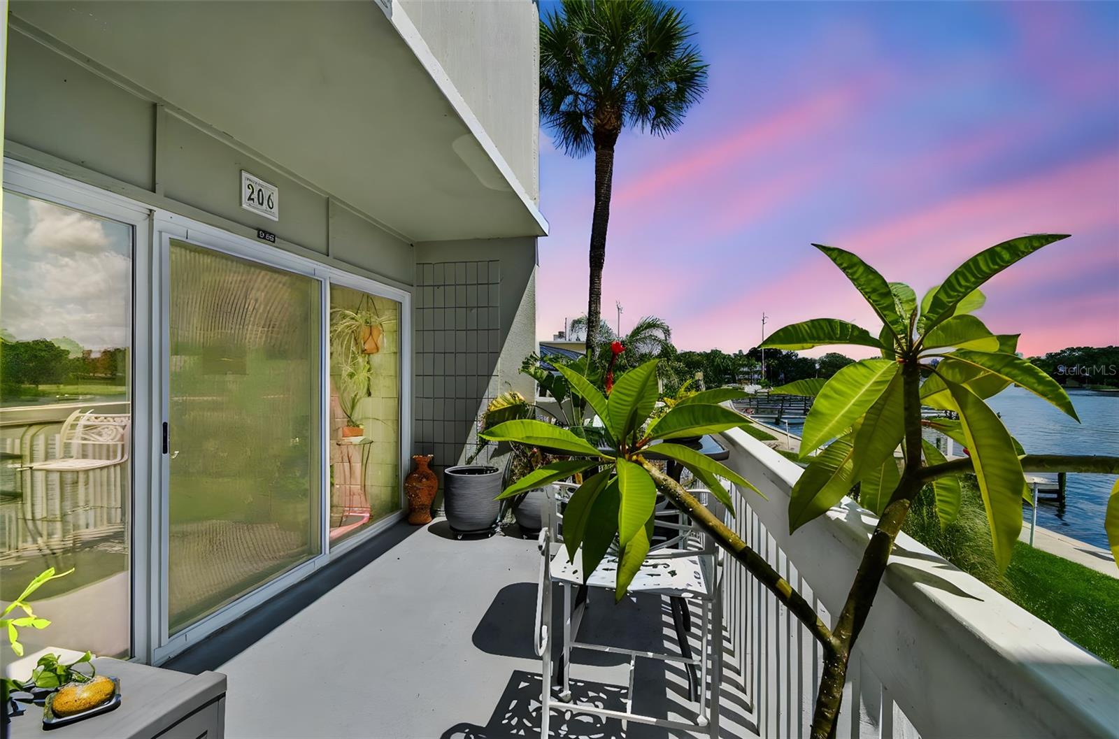 Enjoy stunning water views and a modern urban vibe in this beautifully updated two-story townhouse at The Marina Club. With two full bathrooms, stylish concrete countertops including sink, and sleek custom cabinetry, this home combines character with comfort. The open-concept layout features polished concrete floors, a spacious living area, and large sliders that open to a private balcony overlooking the Hillsborough river. The kitchen has been thoughtfully reimagined with sleek stainless steel appliances, floating wood shelves, and striking contemporary finishes that create a truly jaw-dropping piece for the home. Upstairs, the primary suite offers a second balcony with breathtaking views, while the second room generously sized with a double closet. Both bathrooms have been fully updated with clean, yet modern design. This condo is conveniently located just above the HOA office and gym, with direct access to the court yard. The hot tub and riverfront stairs are just steps away for added convenience. Additional perks include assigned covered parking and an in-unit laundry room, and major system updates that make it move-in ready. This guard gated community offers resort-style living with two sparkling pools, a spa, state-of-the-art fitness center, boat ramp, fishing pier, available boat slips, and riverfront grilling stations. Ideally located just minutes from Downtown Tampa, Armature Works, and Tampa International Airport, with convenient access to medical facilities, including the VA Hospital.