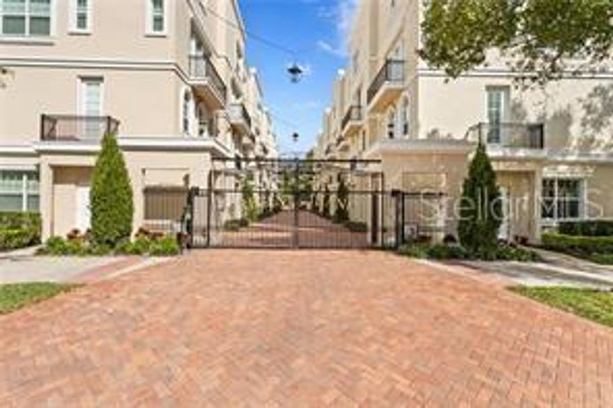 Regent Lane offers an excellent opportunity to own in this gated community of 20 townhomes. Architecturally styled after English mews, this home offers 4 stories of luxurious living, a 5th floor rooftop terrace with wonderful views. The townhome has 9' ceilings with crown molding, wide-plank, engineered wood flooring, solid-core doors, stone quartzite countertops, and a private elevator from the garage. The townhouse includes a private 2-car garage with additional. room for storage,  a wonderful roof-top terrace, balconies, and all the bedrooms are ensuite bedrooms. As a PUD(planned unit development)  the property is "fee-simple" with very low HOA monthly fees. This unit was the model home of the development with the best of everything from location, to easy access and the best views. Beautiful and spacious this home includes a 2-car garage (in tandem) with Tesla charger, and a personal elevator that goes from the garage to all air conditioned levels (not the rooftop patio). This front unit is considered the premier unit of Regents Lane:it is the front right unit which also can be accessed by walking directly into the garage via a door on the exterior wall of the garage, without having to open the gates (great for walking pets), a tremendous perk.  From the ground floor garage ride in the private elevator, or take the stairs from the foyer to the second level which is an artfully designed great room of powder room, living-room, kitchen and dining areas. Everything flows from area to area across rich wide plank engineered hardwood flooring, 9ft ceilings and balcony off the living room. A fabulous and efficient kitchen with a a 10' island in the center of the eat-in kitchen with custom cabinets, glass subway backsplash, and gas-range. The entire third floor is the Primary-suite complete with a sitting area in the primary bedroom, a separate reading nook/study, a large walk-in closet and a gorgeous bathroom suite that's the epitome of elegance. 9 foot ceilings and elevator. The third floor includes two spacious  secondary bedrooms, each ensuite. The bedrooms are on opposite ends of this level, and the laundry closet with wash sink is discreetly located in the hallway between the two bedrooms(there is a laundry hookup in the garage as well) .This configuration offers privacy to those individuals staying in each of the bedrooms, 9' ceilings and elevator. The rooftop terrace is a private getaway space with some wonderful waterfront views, sunrises and also sunsets and the stunning Downtown St Pete skyline. The rooftop is accessed via stairs on the interior to the private oasis for entertaining, meditation, yoga, dinners, and more. Walk to much the city has to offer from the waterfront to restaurants, the Pier, galleries, all the downtown museums, the Vinoy, Hotel, the Central Ave boutiques, theatres and events. Approximately 25 minutes to Tampa International Airport and the world renowned beaches. This is beautiful. Call Listing agent for an appt