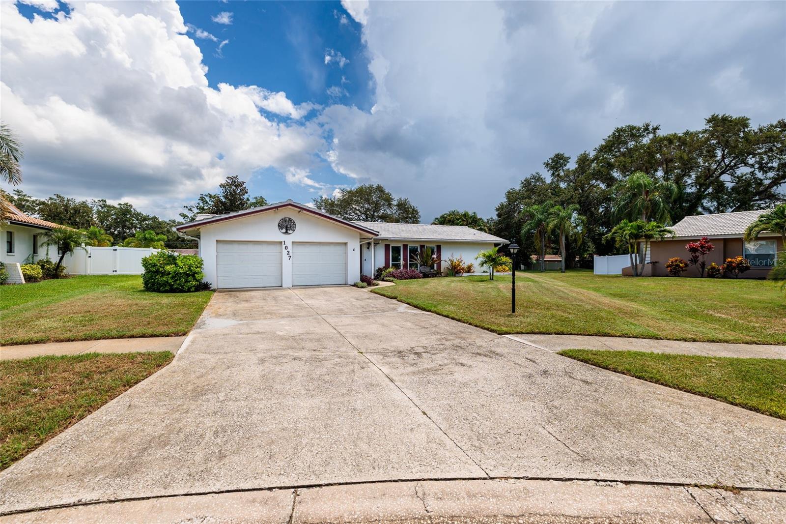 Live the Florida dream in this executive pool residence located in the highly desirable Grovewood Estates. Set on a private .38-acre lot, this home blends elegance and functionality with a spacious split floor plan, resort-style outdoor living, and a central location only minutes from boating, beaches, and the energy of downtown St. Petersburg.
Step inside to find 2,846 sq. ft. of refined living space filled with natural light, highlighted by gleaming walnut wood floors and hurricane-impact windows throughout. The formal living and dining rooms flow into a comfortable family room and a bright, oversized sunroom. With a full wall of Andersen sliding glass doors, the sunroom opens directly to the pool deck and is complete with a custom wet bar featuring Sub-Zero refrigerator, ice maker, Corian countertops, and custom cabinetry—perfect for entertaining.
At the heart of the home, the chef-inspired kitchen boasts tray ceilings with recessed lighting, stainless steel appliances including a double oven, abundant cabinetry, and a clear view of the pool. The private owner’s suite, tucked away off the dining room, features a walk-in closet, ensuite bath, and sliding doors leading to the sunroom. The guest wing offers three spacious bedrooms with a Jack-and-Jill bath and a dedicated pool bath for ultimate convenience.
The outdoor living space is a true retreat, centered around a resurfaced pool (2023) with new tile, pump, and filter. Surrounded by mature privacy hedges and generous decking, the backyard also includes a built-in natural gas grill and ample room for lounging or play.
This residence is loaded with thoughtful upgrades, including a whole-house natural gas generator, 2020 HVAC, 2015 tile roof, 2023 gas water heater, water purification system, three refrigerators, LeafGuard gutters, two new Genie garage door openers, and a well-fed irrigation system. A five-camera security system with Ring doorbell provides peace of mind. The oversized laundry and utility room includes a climate-controlled flex space—ideal for a home office, workshop, or gym. Recent updates include fresh interior paint, new laminate flooring in the family room and two bedrooms, and new carpet in the master and guest suite.
Located in a non-flood zone and one of St. Petersburg’s most established communities, this executive home delivers privacy, functionality, and luxury all in one.
Schedule your private tour today and experience all that Grovewood Estates has to offer.