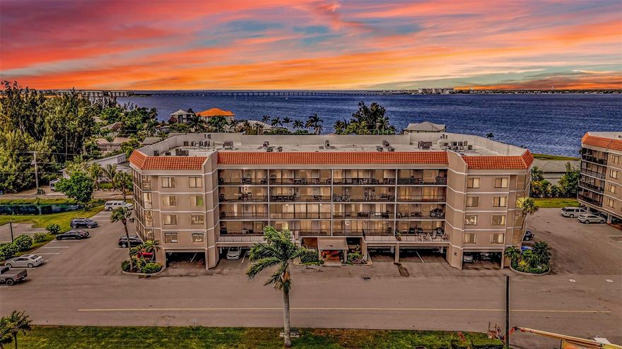 Welcome to 25188 Marion Avenue, Unit E212 in Punta Gorda — a spacious 3-bedroom, 2-bath waterfront condo located in the highly desirable Emerald Pointe community. Designed for both everyday comfort and effortless entertaining, this residence features an open, flowing floor plan with tray ceilings and soaring heights that create a bright, airy ambiance throughout.
Natural light fills the home, drawing your eye to the stunning water views that make this property truly special. Whether you're enjoying a quiet morning coffee or hosting guests at sunset, the peaceful waterfront setting provides the perfect backdrop. The kitchen offers ample counter space for easy meal prep, while a nearby wet bar adds a stylish touch for entertaining.

Each bedroom is generously sized, offering comfort and privacy, and the well-appointed bathrooms enhance the home’s functional layout.

Emerald Pointe delivers an unmatched waterfront lifestyle. Boaters will appreciate access to over 40 boat slips — included in the HOA — along with a vibrant social calendar, three sparkling pools, on site restaurant, huge clubhouse with library room and beautifully maintained grounds create a welcoming and engaging community atmosphere.

If you're looking for low-maintenance living with direct access to boating, social activities, and the best of Southwest Florida, this is your opportunity. Schedule your private showing today and experience waterfront living at its finest.