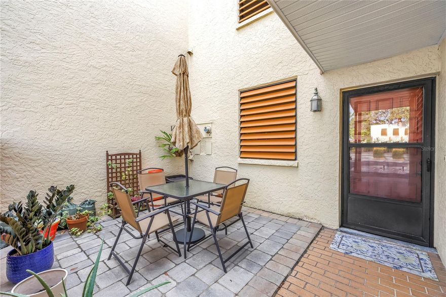 Looking for a first-floor, affordable condo near Anna Maria Island? This spacious and beautifully updated home in Wildewood Springs offers the perfect combination of value, privacy, and true Florida living. Located in one of Bradenton’s most peaceful communities—an actual bird sanctuary surrounded by mature trees and natural beauty—you’ll enjoy over 1,400 sq ft of comfortable living space in a rare first-floor layout.

Before stepping inside, the home welcomes you with a private front courtyard seating area, ideal for sipping morning coffee or enjoying quiet evenings outdoors. The front windows also feature shutters that double as hurricane protection, offering charm and added peace of mind.

Inside, the two bedrooms are impressively spacious, each designed to feel like its own private retreat. Both bedrooms feature large walk-in closets, giving you exceptional storage—something rarely found in condo living. Each bedroom also has its own en suite bathroom, making the layout feel like you have two primary suites. This setup is perfect for hosting guests, shared living arrangements, or simply enjoying extra comfort and privacy. The main bathroom has been thoughtfully updated, and the modern flooring throughout the home adds a clean, fresh feel to every room.

Just beyond the bedrooms, you’ll find one of the most desirable features of the condo: an oversized Florida room that expands your living space and brings in beautiful natural light. This extra-large lanai is perfect for relaxing, reading, entertaining, or setting up a peaceful workspace. With no neighbors directly behind you, the setting feels private and serene—an incredible bonus that’s hard to find. The home is also very close to the community pool, giving you easy access without sacrificing the quiet ambiance.

The condo offers abundant additional storage, including multiple closets throughout the home, making it easy to stay organized and clutter-free.

The building is also scheduled to receive a brand-new roof, and the special assessment for this project will be fully paid by the seller—saving you thousands.

Wildewood Springs features peaceful walking trails, multiple pools, beautifully maintained grounds, and abundant wildlife. All of this is just minutes from Anna Maria Island’s stunning beaches, as well as top dining, shopping, parks, and SRQ Airport.

If you’re seeking an affordable, first-floor condo with privacy, space, and unbeatable proximity to Anna Maria Island, this home is truly a rare find.