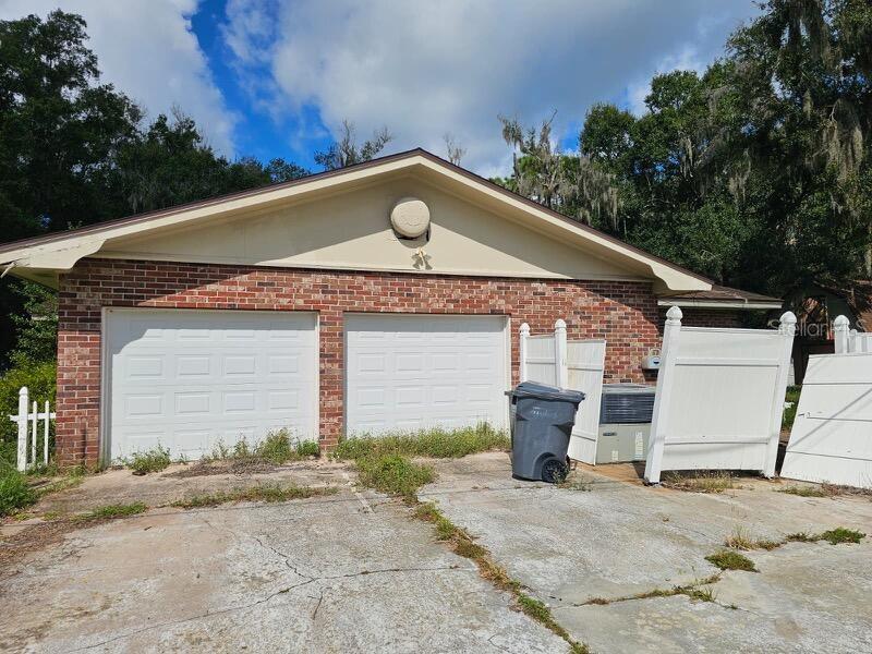 Country Charm Meets Unlimited Potential in North Lakeland
Escape to peace and privacy in this spacious 3-bedroom, 3-bath single-family home, perfectly situated on a .88-acre corner fenced lot in the serene landscapes of North Lakeland. This inviting property offers an exceptional opportunity for those seeking a blank canvas to craft their dream home or for those looking for a solid investment property.
Step onto the welcoming front porch, ideal for quiet mornings. Inside, a double foyer entry opens to a sunken living room filled with natural light, highlighted by a large front window. The formal dining room accommodates intimate dinners or large gatherings, with sliding glass doors that open to a screened lanai, creating the perfect indoor-outdoor flow.
The cathedral-beamed family room is warm and spacious, featuring wall-to-wall sliding glass doors, letting the outdoors in. The U-shaped kitchen offers plenty of cabinetry, expansive countertops, and a double-duty snack bar for casual meals or meal prep.
The primary suite includes a large en suite bathroom and ample space to relax. With three full bathrooms, an inside laundry room with a built-in desk and pantry, this home is as functional as it is full of potential.
Outside, the property boasts plenty of space for RV, boat, or trailer parking and a detached barn/workshop with a second-story loft—perfect for hobbies, storage, or future conversion. A side-entry two-car garage completes the package.
Whether you're looking for a forever home, a fixer-upper investment, or a chance to customize your dream retreat, this North Lakeland gem offers unmatched space, charm, and opportunity.
Bring your vision and unlock the potential!