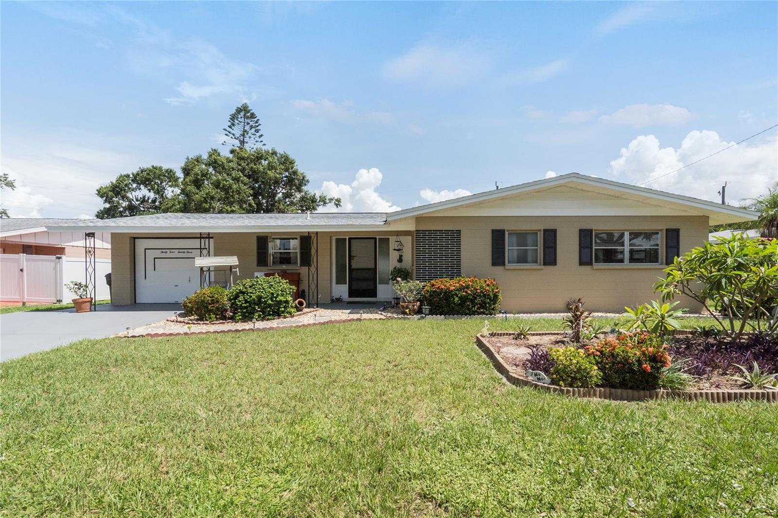 Preferred Lender is offering 1% of the loan amount as a lender credit towards buyers closing costs or interest rate buydowns on this specific home! This charming house offers approximately 1,289 square feet of living space and sits on a lot of approximately 0.23 acres. The home features two bedrooms and two bathrooms, providing a spacious and comfortable living environment.
The exterior of the home is well-maintained, showcasing a NEW ROOF 2025 and an inviting landscaping that creates a welcoming atmosphere. The spacious layout of the interior allows for abundant natural light, enhancing the overall brightness and airy feel of the home. The primary bedroom offers a cozy and comfortable space along with a walk-in closet, while the secondary bedroom provides ample room for guests or additional living needs and a walk-in closet.
The bathrooms are designed with spacious layouts, offering ample countertop space and organized storage solutions. The kitchen features a neutral color palette and a generous amount of solid wood cabinetry, providing plenty of storage and preparation space.
The home's mid-century modern design elements contribute to a timeless aesthetic, with the spacious patio and lush landscaping in the backyard creating a serene oasis for outdoor enjoyment. The well-maintained lawn and yard offer opportunities for gardening, relaxation, recreational activities and plenty of room to add a pool.
Overall, this property presents a unique and desirable living opportunity, with its thoughtful design, ample living spaces, and well-appointed features. This home is also in close proximity to Sarasota #1 beaches, active downtown area, restaurants and much more! This is the hidden gem you have been looking for.