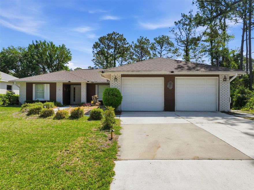 Amazing opportunity! HOME + ADJACENT VACANT LOT!!! Pine Lakes neighborhood home with mother-in-law suite! In-Law suite has its own entrance, fridge, stove, microwave, HVAC, water heater, walk-in shower. ROOF 2021. Tile & laminate flooring throughout the home. Spacious and bright, numerous skylights throughout the house, vaulted ceilings. Whole-house hurricane shutters, sprinkler system on well, all around gutters.