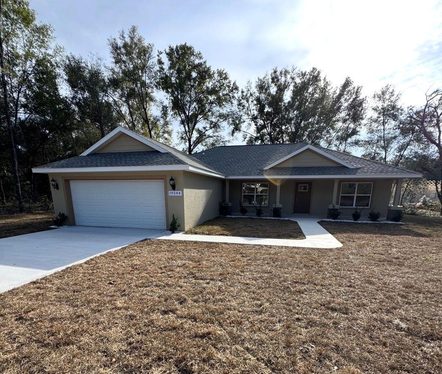 ALMOST COMPLETE! PROFESSIONAL PICTURES COMING SOON. Welcome to your brand-new home in Citrus Springs, where quality craftsmanship meets everyday comfort. This thoughtfully designed 3-bedroom, 2-bath residence is newly completed and built with care by Empire Construction. From top to bottom, it offers stylish upgrades, energy efficiency, and a layout that suits today’s lifestyle. As you enter, you’re greeted by tall ceilings and an open floor plan that makes the most of every square foot. The main living area connects effortlessly to the kitchen and dining space, creating a perfect setup for gathering with friends or enjoying quiet evenings at home. The kitchen is beautifully finished with granite counters, soft-close cabinets, and sleek hardware, all brought together by durable luxury vinyl flooring that runs throughout the home. Natural light pours in through energy-efficient windows and a wide sliding glass door, which leads to a covered patio in the backyard. It’s the ideal spot to relax, grill out, or enjoy Florida’s sunshine in peace. The owner’s suite is set apart from the guest rooms for privacy and includes elegant ceiling details, dual sinks, and a tiled walk-in shower. Behind the scenes, this home is just as impressive. Upgraded insulation in both walls and ceiling helps keep utility bills low. Underground electrical service adds to the clean look of the property, and a meter/main combo provides added convenience for future expansion. The exterior is just as inviting, with a classic front porch ready for your rocking chairs. A spacious two-car garage with a side access door offers additional storage and functionality. This home is perfectly positioned within a short drive to local rivers, springs, and parks, not to mention shopping, dining, and new retail centers nearby. It’s the kind of place that gives you room to breathe without being far from the essentials. If you’re looking for something new, well built, and ready to go, this one deserves your attention. Builder incentives and closing cost assistance may be available, reach out for details and come see the difference for yourself. Homes like this don’t stay on the market long.