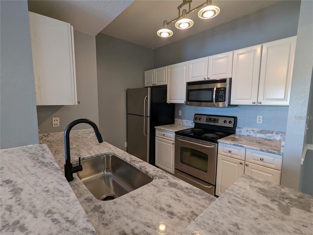 Photo of 14229 Falls Church Drive #1715, Orlando, FL 32837 (MLS # O6449136)