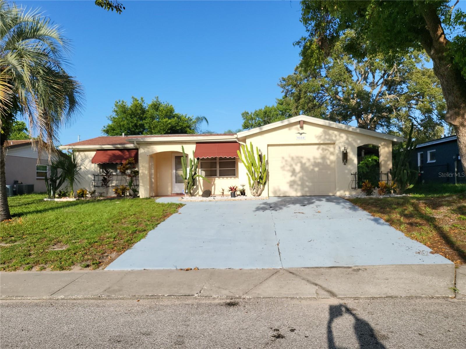 Welcome to this delightful 3-bedroom, 2-bathroom residence nestled in one of Port Richey’s most well-established neighborhoods, The Lakes. Set among mature trees and friendly neighbors, this home offers the perfect blend of comfort, style, and convenience. Enjoy easy access to main roads, making your daily commute or weekend adventures a breeze while relishing the tranquility of a settled community.
Step inside to discover a spacious living room and dining room combination, ideal for entertaining guests or enjoying family gatherings. Large sliders bathe the living area in natural light and open seamlessly onto a cozy lanai, creating a perfect indoor-outdoor flow. Step further onto the concrete patio—an inviting space for grilling, relaxing, or soaking up the Florida sunshine.
This home boasts stunning new wood flooring throughout the main living areas and bedrooms, lending warmth and elegance to every gathering. Both bathrooms feature new, easy-care flooring, ensuring modern comfort from top to bottom. The primary bedroom is a true retreat, complete with a generous walk-in closet and a luxurious en-suite bathroom for ultimate privacy and relaxation. The new kitchen will be installed this week.
The backyard is fully enclosed with a durable chain link fence—perfect for pets, play, or simply enjoying the outdoors in peace. An efficient sprinkler system, sourced from a private well, keeps the lush lawn and landscaping green year-round.
Additional amenities include a one-car garage with a convenient garage door opener, providing both storage and security for your vehicle and belongings. The property’s location within a well-established neighborhood means you’ll benefit from nearby shops, schools, parks, and all the essentials.
If you’re seeking a move-in ready home with thoughtful updates and classic Florida charm, look no further. Schedule your private tour today and experience all this Port Richey gem has.