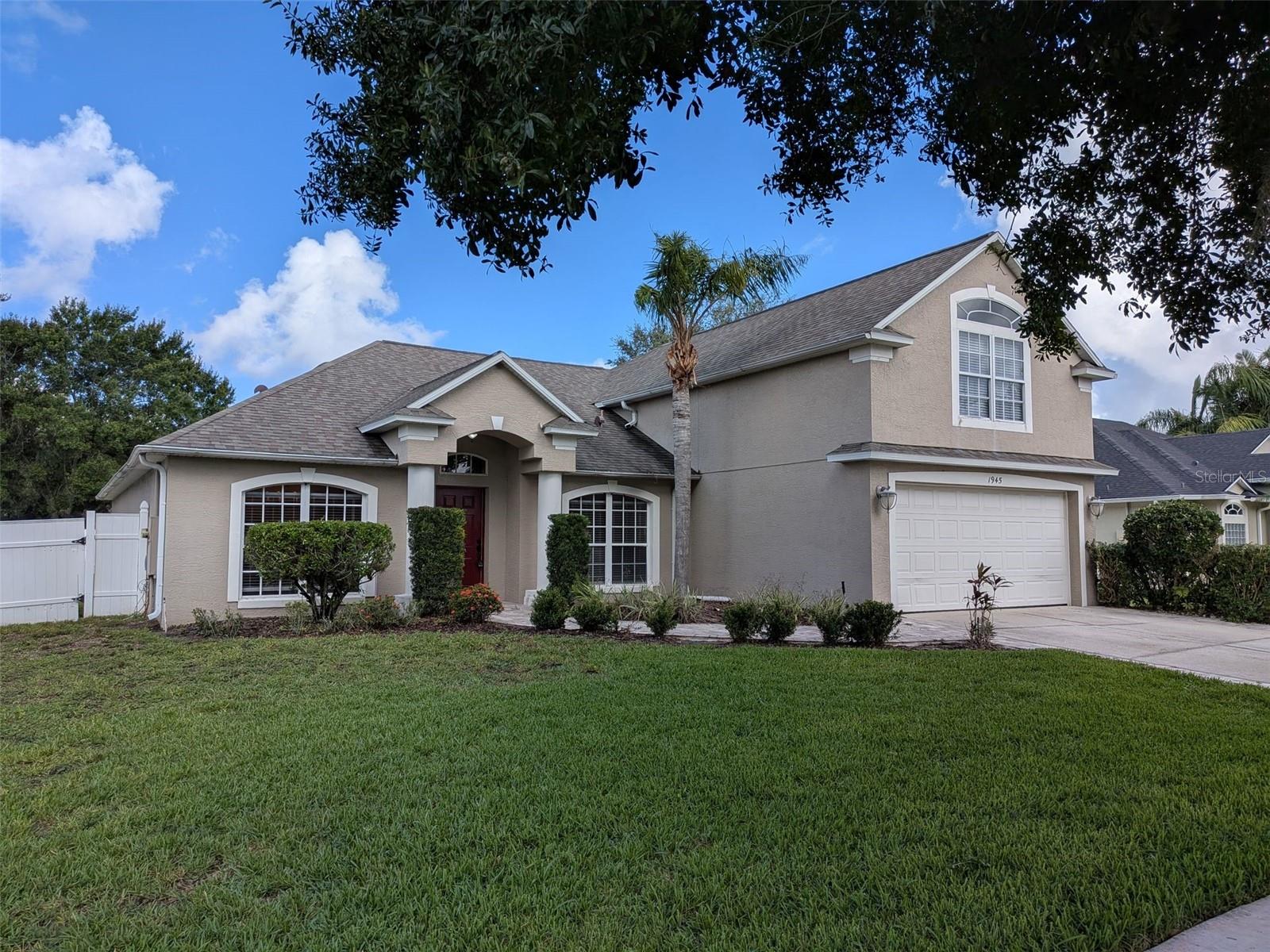 Spacious, updated, 5 bedroom, 3 bathroom single family home in the gated community of East Lake Cove. Split floor plan with large in-law suite on second floor. Primary bedroom features completely renovated bathroom and two walk in closets. Tile and laminate flooring throughout entire home, no carpet. Laundry room with washer / dryer. 2 car garage. Large fenced in back yard. Dry bar on outdoor patio. Updated kitchen with stone countertops and stainless steel appliances. Lawn care included.