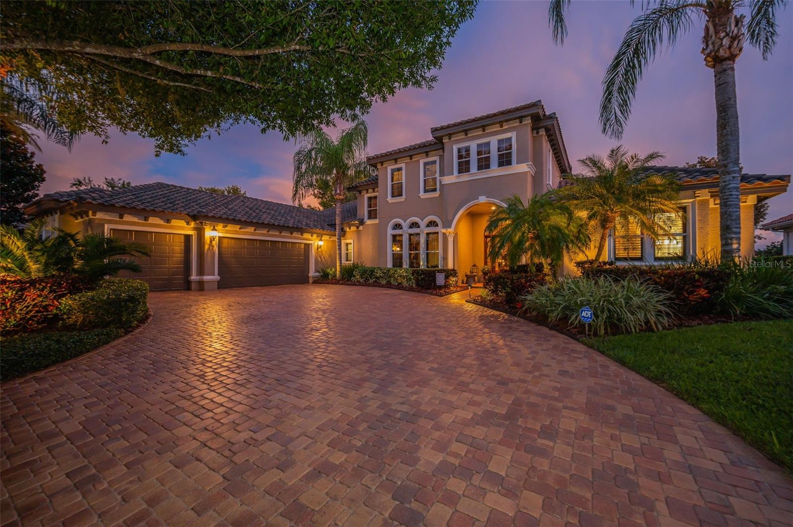 Experience refined Florida living in this exquisitely maintained luxury residence, perfectly situated on a premium waterfront and golf course lot with breathtaking views. This stunning estate is located in sought after gated enclave of Floresta at Champions Club, nestled on renowned Fox Hollow Golf Course. This custom designed home offers over 4500 sq ft of elegant living space with 4 bedrooms, a private office, 5 bathrooms, first floor bonus/media room/home theater featuring top-of-the-line audiovisual equipment, a wet bar and billiards area. Designed for both grand entertaining and everyday comfort, the home features a formal living and dining room with bar, gourmet kitchen with granite countertops and stainless-steel appliances (built-in refrigerator replaced in December of 2023), 6 burner natural gas range, raised-panel maple cabinets, center island, wall oven & microwave, wine fridge, warming drawer, walk-in pantry, eat in space off kitchen and a large family
room. Oversized primary suite has sitting area, walk-in closets, double sinks, walk-in shower and jetted tub. Upstairs, there are three bedrooms and a bonus loft living area that provides additional comfort with brand new carpet throughout (Dec. 2023). The home also features hardwood and tile floors, crown molding, volume ceilings, tray ceilings, plantation shutters, upgraded fans and light fixtures, 9" baseboards, double pane Low-E windows & doors, a newer top-of-the-line Trane HVAC system (all units replaced in Dec. 2023), a new main electrical panel (upgraded and replaced in 2023), a whole-house generator, fresh interior paint (2024), freshly painted exterior, oversized 3 car garage with new garage door opener (Dec. 2023) and a new tile roof (2021). The stunning outdoor entertaining area features an outdoor living room, a large flat screen TV, custom sound system, outdoor kitchen, gas fireplace, and a Diamond Brite gas and solar-heated pool with spillover spa, all surrounded by a screened lanai, tropical landscaping, outdoor lighting to rounds out the extraordinary outdoor entertaining area. There are freshly sealed pavers in the driveway and lanai and a full irrigation system, plus so much more… Champions Club offers residents exclusive access to a grand clubhouse with resort-style amenities: pool and spa, tennis courts, basketball court, fitness center, outdoor grills, and a calendar full of social activities. Ideally located near top-rated schools, medical facilities, shopping, dining, and with easy access to Tampa International Airport and world-famous beaches. Truly a rare opportunity to own a custom luxury home with unmatched views and exceptional upgrades. Schedule your private tour today!