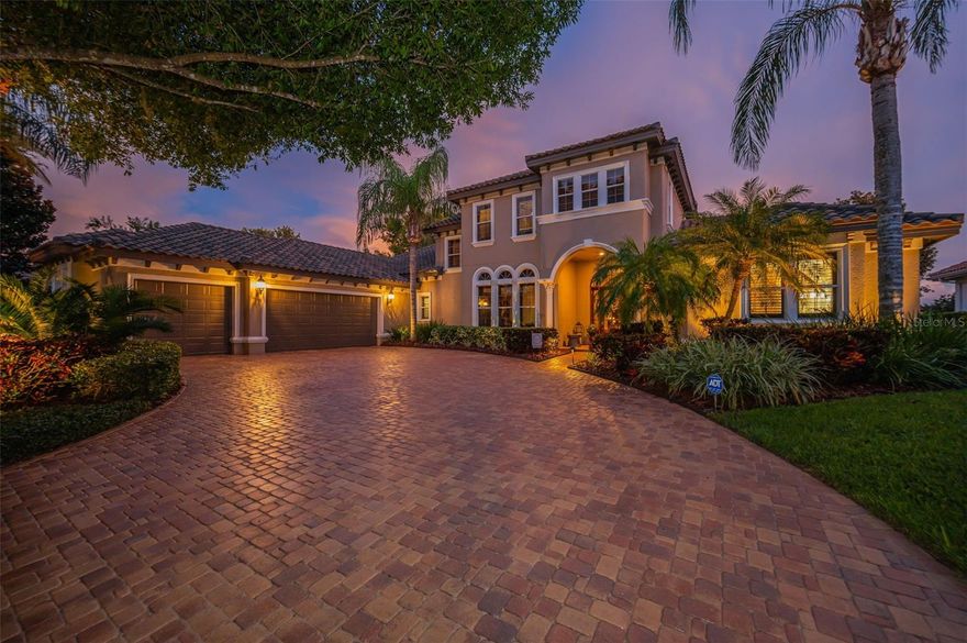 Experience refined Florida living in this exquisitely maintained luxury residence, perfectly situated on a premium waterfront and golf course lot with breathtaking views.  This stunning estate is located in sought after gated enclave of Floresta at Champions Club, nestled on renowned Fox Hollow Golf Course.  This custom designed home offers over 4500 sq ft of elegant living space with 4 bedrooms, a private office, 5 bathrooms,  first floor bonus/media room/home theater featuring top-of-the-line audiovisual equipment, a wet bar and billiards area. Designed for both grand entertaining and everyday comfort, the home features a formal living and dining room with bar, gourmet kitchen with granite countertops and stainless-steel appliances (built-in refrigerator replaced in December of 2023),  6 burner natural gas range, raised-panel maple cabinets, center island, wall oven & microwave, wine fridge, warming drawer, walk-in pantry, eat in space off kitchen and a large family 
room. Oversized primary suite has sitting area, walk-in closets, double sinks, walk-in shower and jetted tub. Upstairs, there are three bedrooms and a bonus loft living area that provides additional comfort with brand new carpet throughout (Dec. 2023).  The home also features hardwood and tile floors, crown molding, volume ceilings, tray ceilings, plantation shutters, upgraded fans and light fixtures, 9" baseboards, double pane Low-E windows & doors, a newer  top-of-the-line Trane HVAC system (all units replaced in Dec. 2023), a new main electrical panel (upgraded and replaced in 2023),  a whole-house generator, fresh interior paint (2024), freshly painted exterior, oversized 3 car garage with new garage door opener (Dec. 2023) and a new tile roof (2021). The stunning outdoor entertaining area features an outdoor living room, a large flat screen TV, custom sound system, outdoor kitchen, gas fireplace, and a Diamond Brite gas and solar-heated pool with spillover spa, all surrounded by a screened lanai, tropical landscaping, outdoor lighting to rounds out the extraordinary outdoor entertaining area.  There are freshly sealed pavers in the driveway and lanai and a full irrigation system, plus so much more…  Champions Club offers residents exclusive access to a grand clubhouse with resort-style amenities: pool and spa, tennis courts, basketball court, fitness center, outdoor grills, and a calendar full of social activities. Ideally located near top-rated schools, medical facilities, shopping, dining, and with easy access to Tampa International Airport and world-famous beaches. Truly a rare opportunity to own a custom luxury home with unmatched views and exceptional upgrades. Schedule your private tour today!