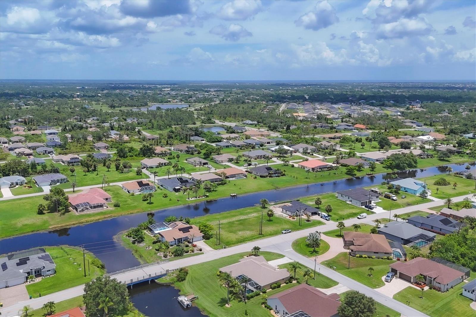 Turnkey Furnished Solar Pool Home Near Beaches & Golf! Welcome to your fully furnished Florida retreat — a beautifully maintained 3-bedroom, 2-bath, 2-car garage home with dual canal views, ideally located just minutes from world-famous Gulf beaches, 5 championship golf courses, and a vibrant community center filled with year-round events and activities. This turnkey furnished home is move-in or rental ready, offering fantastic income potential for seasonal or long-term stays. A 2023 solar power system keeps your electric bills around $27/month, making this an incredibly cost-efficient property to own and operate. Newer Roof 2022, A/C in 2021 and easy to use accordion shutters give piece of mind. Enjoy the saltwater pool, resurfaced with a newer heater (2019), and entertain with ease on the oversized screened lanai—perfect for barbecues, sunbathing, or simply relaxing in the Florida sunshine. Inside, the split floor plan and cathedral ceilings create an open, airy layout ideal for hosting and guest privacy. The updated kitchen with granite countertops pairs beautifully with fruit from your own mature mango, banana, avocado, and citrus trees. The private primary suite offers a spa-like bath with a garden tub, walk-in shower, dual vanities, and vaulted ceilings. The guest wing includes a bath with direct pool access, adding convenience for visitors or renters alike. Additional features: • Re-piped with PEX in 2008 • Whole-house surge protector • TREX flooring in garage • High-demand location for vacation or seasonal rental This home truly has it all — low-maintenance living, strong rental potential, and a location that delivers the best of the Florida lifestyle. Don’t miss the 3D virtual tour and floor plan— schedule your private showing today!