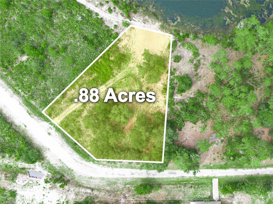 This waterfront .88 acre parcel is located in the golf community of Indian Lake Estates.  Zoned residential, this lot has 86 feet of pond frontage.  You'll have access to Lake Walk in the Water, a 7500 acre lake that is considered to be one of the best bass fishing lakes in all of Florida.  The lake has a beach, boat ramp and marina, plus the longest freshwater fishing pier in the state.  There's even a pavilion that has gas grills and covered tables for lakeside family picnics.  Enjoy all the community has to offer, including an 18-hole golf course, basketball and tennis courts, a clubhouse, cafe and pro shop, library and fitness center.  This truly is the perfect place to build your forever home, so call today before it's gone!