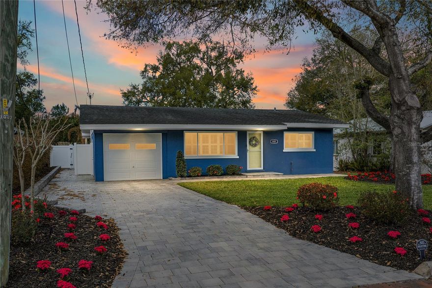 Just a short stroll—less than a quarter mile—from the scenic shores of Lake Hollingsworth, this beautifully renovated three-bedroom, two-bathroom pool home captures the perfect balance of historic charm and modern comfort in one of Lakeland’s most beloved neighborhoods.  From the moment you arrive, the curb appeal sets a welcoming tone. A well-manicured lawn of lush green grass frames the home, while thoughtfully mulched flowerbeds dotted with vibrant red blooms create a colorful and inviting landscape. The property’s fully fenced backyard offers both privacy and peace of mind, creating a serene outdoor retreat for relaxing afternoons or lively gatherings with friends and family.  Step inside and you’ll immediately notice the home’s warm, inviting character. The living room is anchored by a striking white-washed brick feature wall that adds texture and timeless style, while rich wood flooring flows through the main living areas. Bright, neutral walls and abundant natural light create an airy atmosphere that feels both sophisticated and comfortable.  The fully renovated kitchen serves as the heart of the home. Designed with both beauty and function in mind, it features modern cabinetry, elegant stone countertops, and sleek appliances—including a gas-powered range that will delight any home chef. Whether preparing everyday meals or entertaining guests, this thoughtfully designed space makes cooking and gathering effortless.  The bathrooms have also been completely updated with a stylish blend of classic and contemporary design. Hexagonal tile flooring adds a distinctive touch, while subway-tile-clad showers provide a clean, timeless look that complements the home’s overall aesthetic.  Natural light pours through the home’s recently updated windows, many of which are accented with plantation shutters that add architectural character while offering easy control of light and privacy.  Just off the kitchen, a dedicated laundry room provides convenience and functionality, along with direct access to the covered and screened patio. Outfitted with ceiling fans and lighting, this outdoor living space is ideal for casual evenings, weekend barbecues, or simply unwinding after a long day.  Beyond the patio, the backyard transforms into a private oasis. Installed in 2022, the in-ground saltwater pool is surrounded by a spacious pavered deck that offers plenty of room for lounge chairs, outdoor dining, or sun-soaked relaxation. Modern horizontal wood walls elegantly conceal the pool equipment, maintaining the clean, polished look of the outdoor space. The pool’s salt cell was replaced less than a year ago, and the pump is only 18 months old—providing peace of mind for years of enjoyment ahead.  Combining thoughtful renovations, timeless design details, and an unbeatable location just moments from the walking paths and scenic beauty of Lake Hollingsworth, this home offers the very best of Lakeland living—where charm, comfort, and lifestyle come together beautifully.