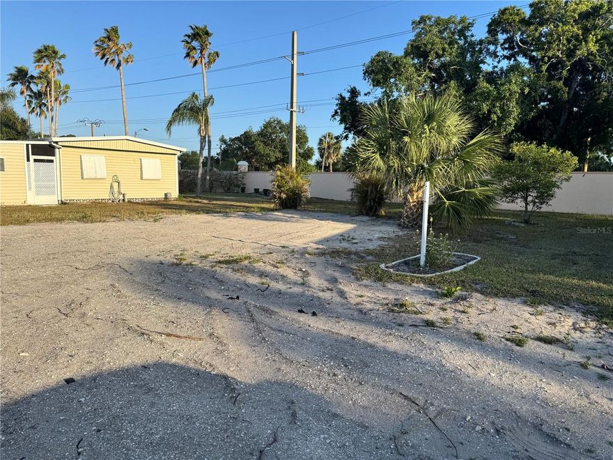 Build New in Golf Lakes – 55+ Pet-Free Community! This vacant 50’ x 80’ cul-de-sac lot is ready for your brand-new manufactured home (up to 30’ x 56’), with space to add a carport and shed—offering over 1,500 sq ft of potential living space. All hookups are already in place. Located in the highly desirable Golf Lakes community, residents enjoy ownership of the entire 121-acre park through a Co-Operative governed by an elected Board of Directors. The land beneath your home is yours via a renewable 99-year proprietary lease. Enjoy resort-style amenities including golf, a heated pool and spa, pickleball, basketball, and more. Maintenance fees include cable, internet, water, and sewer. Membership requires a background and credit check. Please note: Golf Lakes is a pet-free community. Don’t miss this rare opportunity to build new in one of Bradenton’s most active and beautifully maintained 55+ communities!
