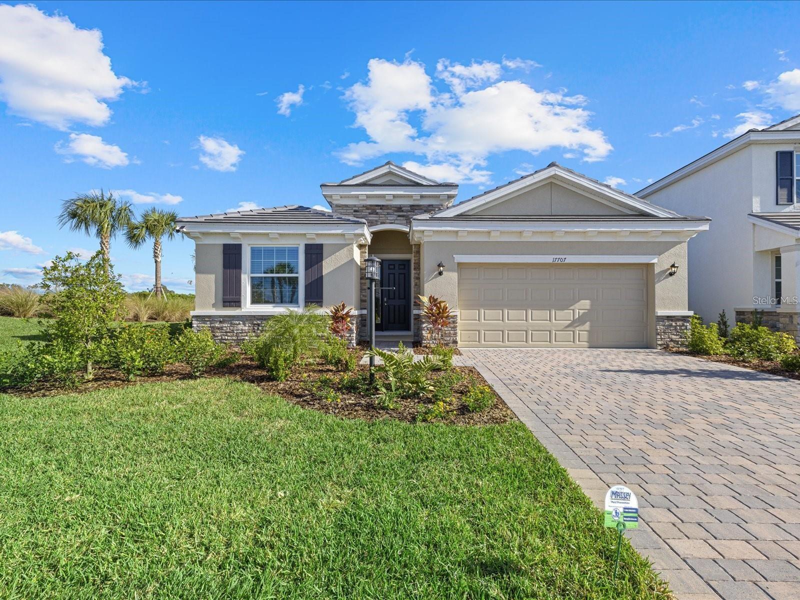 Welcome to the very spacious and bright home in Star Farms at Lakewood Ranch with Resort~like Amenities. This DR Horton popular "Lantana" floor plan features 4 bedrooms and 2 and a half baths. This home has the perfect floor plan for everyone, with tons of upgrades and a great corner lot that opens up to the beautiful views of the pond. Boasting over 2,000 square feet, this home features four comfortable bedrooms, 2.5 bathrooms, a two car garage, and an inviting open floor plan with high ceilings. The master suite is a retreat in itself, complete with his and hers walk-in closets to keep your belongings organized. Step outside to the extended lanai, perfect for enjoying outdoor activities, grilling, and entertaining guests. The backyard is an oasis of relaxation. The kitchen is equipped with like-new Whirlpool stainless steel appliances, including a refrigerator, range, microwave, and dishwasher, ensuring a modern and efficient cooking experience. Star Farms at Lakewood Ranch offers an amazing community lifestyle with easy access to a range of amenities, such as pool, playgrounds, tennis courts, fitness center. You're just a short drive away from the UTC Mall, PopStroke Golf, Benderson Park...offering the best Florida has to offer. Harmony is located within an A-rated school district, with Lakewood Ranch High School almost around the corner and the Out-of-Door- Academy is a quick commute. An application is $40 per person.