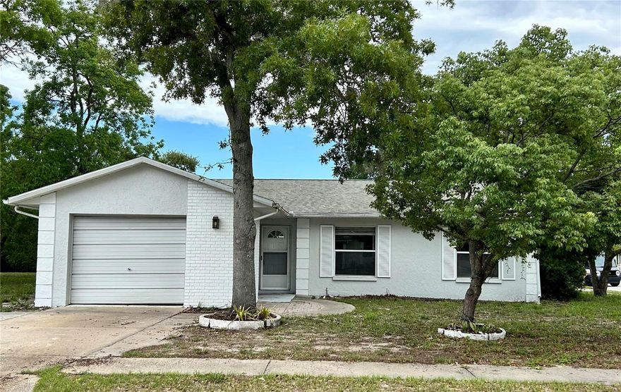 NEAT & CLEAN  -  Needs a little TLC
Surrounded by mature shade trees, this 1,051 square foot home with attached garage is located in quiet family neighborhood of Beacon Square East. A modest quarterly HOA gives you access to clubhouse, pool, tennis courts and park area with playground. Get to know your neighbors as you take evening walks along the quiet streets with sidewalks throughout.

For this house, the decorating is up to you: choose the flooring you would like in the bedrooms and update baths and kitchen to your taste. With a little TLC, you can have instant equity.

Convenient to main traffic arteries of Little Road, Highway 52 and Highway 19 and the Suncoast Parkway.