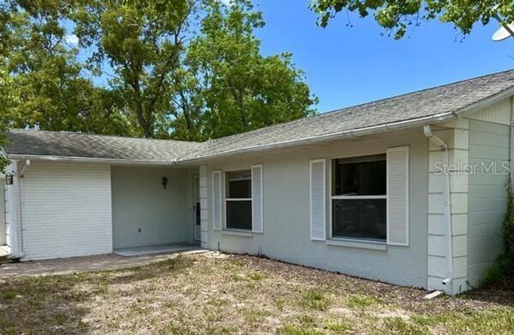Photo of 8907 Wayward Circle, Hudson, FL 34667 (MLS # O6407239)