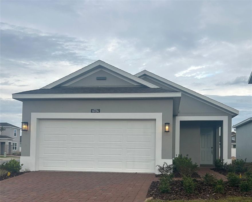 This thoughtfully designed 4-bedroom, 2-bath home is situated on a desirable corner homesite and boasts an open-concept layout with impressive 9'4" ceilings, perfect for modern living. The spacious Great Room flows seamlessly into the rear covered Lanai, creating an ideal space for entertaining or enjoying Florida’s indoor-outdoor lifestyle. The well-appointed Kitchen features 42” cabinets topped with crown molding, sleek stone countertops, tile backsplash, and stainless steel appliances. Durable tile flooring extends through the main living areas, while window blinds are included throughout the home for added comfort and privacy. The Primary Suite offers a private retreat with an ensuite Bath featuring large walk-in closet, adult-height dual-sink vanity, and shower with wall tile surround. A 2-car garage completes this well-appointed home designed with everyday convenience and comfort in mind. Community amenities include Resort-style Pool and shaded Playground. Eagletail Landings is located just south of Lake Harris and near some of the best outdoor recreation, as well as Lake County's breathtaking chain of lakes and scenic trails, and a thriving downtown area is just a short drive away, along with 2 nearby championship golf courses designed for a challenging and enjoyable day on the greens.