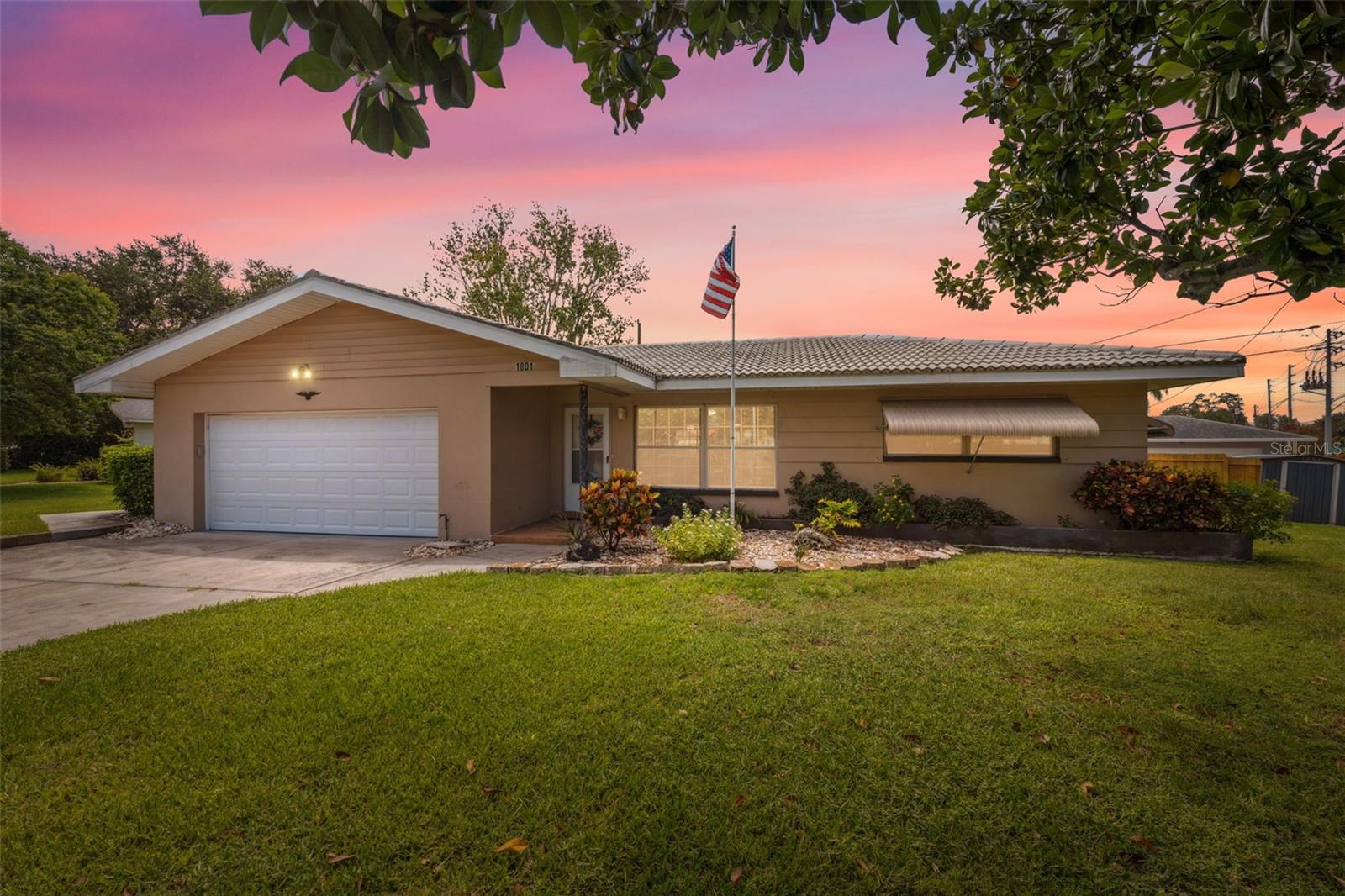 Welcome to 1801 Redcoat Lane, Clearwater! This charming 2-bedroom, 2-bath home with a spacious 2-car garage offers the perfect combination of comfort, flexibility, and Florida lifestyle with NO HOA, NO CDD, and short-term rentals like Airbnb welcome! Located on a corner lot, the property is not in a flood or evacuation zone and stayed high and dry during recent hurricanes, providing added peace of mind. Inside, you’ll find brand-new luxury vinyl flooring throughout most of the home, newer hurricane windows, a functional split-bedroom layout, and open living areas ideal for entertaining or relaxing. Step outside to your private backyard oasis, complete with a hot tub the perfect retreat after a long day. And for an extra unique touch, there’s even a mature coffee plant growing on the property! Whether you're a first-time buyer, seasonal resident, or investor, this Clearwater gem has everything you need. Don’t miss out—schedule your private showing today!