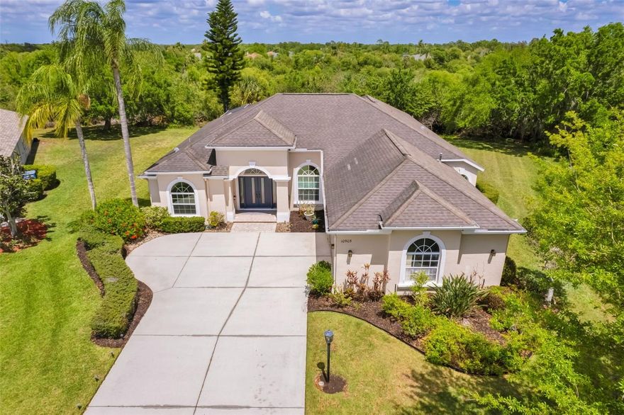 Well positioned on the rear of a quiet cul de sac on an oversized 1/3-acre homesite in Lakewood Ranch, this four-bedroom, three-bath residence offers privacy, convenience and a desirable setting. The split floor plan has three beds on one side and owner's suite on other. Floorplan includes distinct living and dining room thru brand new impact-rated front double doors, kitchen with island and dinette with an aquarium window overlooking pool and woods flowing into the family room, and a rear bonus room for office, exercise, or overflow. A double-sided gas fireplace connects family and bonus rooms providing more views of the preserve. Dedicated laundry room. Mudroom from the garage.
Sliding glass doors - some pocketing - open to covered lanai with pool and spa. Freshly painted interior.  Dual-zoned air conditioner with ultraviolet mold control, most windows updated to hurricane-impact glass and new plumbing for instant water heater. Oversized garage. Roof replaced 2017. The cul-de-sac features a landscaped central island with a gazebo and mature oak trees. Low HOA fees.
Two miles to Lakewood Ranch Main Street's restaurants, shops, gyms, salons and weekly community events.