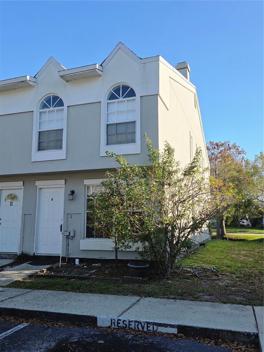 Welcome to Pinebrook Estates in the heart of Largo, Florida! This 2-bedroom, 2.5-bath corner end-unit townhome offers incredible potential for buyers looking to create their own vision while enjoying a fantastic Pinellas County location.  Inside, you’ll find a nice layout featuring a cozy wood-burning fireplace, adding warmth and character to the main living area. The kitchen includes an eat-in dining space, offering a comfortable area for everyday meals and casual gatherings. The home also features convenient indoor laundry, making daily living even easier. With great bones and a functional floor plan, this property is the perfect opportunity for someone ready to update and remodel to their own style. A brand-new AC system has already been installed, addressing one of the major improvements. Upstairs, both nicely sized bedrooms provide comfortable retreats with great natural light. Step out back to the screened-in porch overlooking a peaceful pond, creating a relaxing setting to enjoy your morning coffee or unwind in the evenings with tranquil water views.  As a corner end unit, the home offers additional privacy and extra light throughout the space. With a little TLC and updating, this property could truly shine and become a beautiful residence.  For buyers or investors, this home also presents excellent investment potential. With the right renovations, it could make a fantastic long-term rental, seasonal property, or value-add opportunity in a highly desirable area.  Located in the sought-after Pinebrook Estates community, the property is centrally located in Pinellas County—just a short drive to the award-winning Gulf beaches, Tampa International Airport, and surrounded by great shopping, dining, parks, and entertainment. Whether you’re looking for a primary home, renovation project, or investment opportunity, this townhome offers location, potential, and value in one of the most convenient areas of Pinellas County.