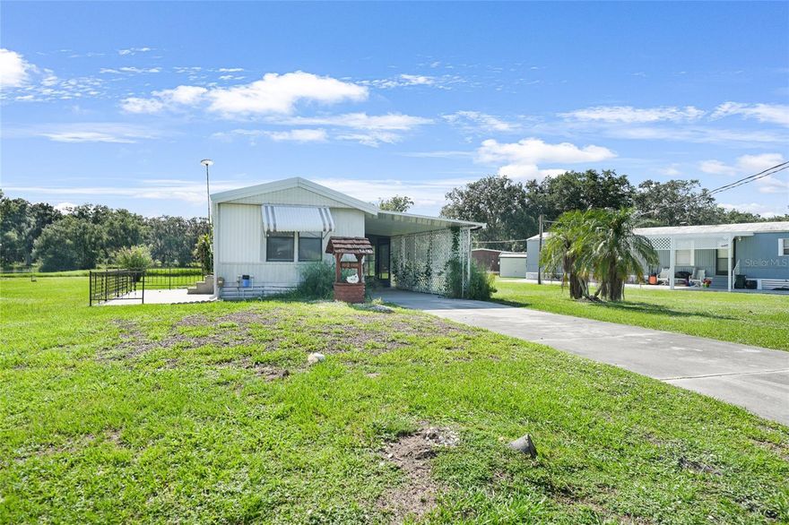 Looking for a slice of sunny paradise? This gem in a friendly 55+ community has everything you need for easy, breezy Florida living—and it comes with land ownership, no lot rent! With two split bedrooms, two bathrooms, and newer flooring throughout, this home is the perfect retreat for seasonal snowbirds or anyone craving a simpler pace year-round. The open kitchen, living, and dining space is ideal for hosting friends or enjoying peaceful mornings with sunshine pouring in. There’s even an indoor laundry area for added convenience. The screened-in porch is an added bonus along with the serene lake views—a little slice of Old Florida charm right in your backyard. Outside, you’ll appreciate the one-car carport and plenty of room to enjoy the warm breeze. Located less than an hour from I-75, airports, beaches, golf, and top-tier medical care, plus all the antique shops and charm of downtown Arcadia, this home is both a steal and a lifestyle. All this under $90,000? Pack your bags—paradise is calling!