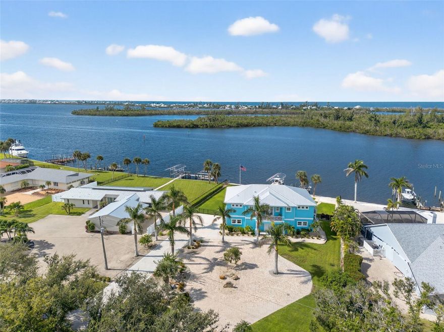 Built in 2020, this superbly crafted, luxury waterfront residence is perfectly positioned on 126 feet of prime Intracoastal Waterway frontage.  Set on about .6 acres of impeccably landscaped grounds in the quiet Vanderbilt developed neighborhood of Cape Haze, with streets lined with towering banyan trees, the property enjoys a secluded old Florida setting.   The residence offers the best of both worlds, with large vessel dockage at your back door and absolutely spectacular bay views, stretching to the Boca Grande bridge, Little Gasparilla Island and beyond. The nearly new home was built by an elite local builder, Jeb Bergeron Custom Homes.  Designed and constructed to the highest coastal construction standards, with concrete tapered pilings, poured concrete beams, concrete block, thoroughly elevated, high-impact resistant windows and sliders, metal roofing, and a whole house generator provides lasting quality and more peace of mind.  Inside the 4,241 total square foot home there's 3 bedrooms and 3.5 baths, each with a private en-suite, a grand open and elegant layout with light filled spaces, tall 11-foot+ vaulted beamed ceilings, that fully opens up and savors the mesmerizing nautical views.  The chef's kitchen combines luxury and function with custom cabinetry, stone counter tops, a Wolf gas range, Sub-Zero refrigerator, and a beautifully crafted island. Other custom features include crown molding, case windows, solid core doors, beautifully tiled bathrooms, tankless gas water heater, premium plumbing and lighting fixtures. Outdoor living is equally impressive, with an immense screened second floor porch and ground level patio that run the entire length of the home.  A stunning swimming pool and spa, paver patio and walkways, a large outdoor kitchen and bar, complete with a built-in gas grill, perfect for waterfront lounging and entertaining.  An absolute boater's and fisherman's dream with world-class fishing waters and legendary boat destinations at your fingertips.  Just a few steps to step onto your boat and within minutes be fishing for tarpon, back country or be in the Gulf headed for an offshore catch.  Or take the guests on relaxing day trip adventures to an endless number of destinations including Boca Grande, Cabbage Key, Useppa, Captiva, Bokeelia, and Sanibel.  The Cape Haze Property Owner's Association private dock and beach along with the Don Pedro Island State Park are just across the Waterway where gorgeous uninhabited beaches await.