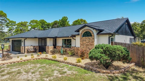 Photo of 9238 Tree Top Lane, Hudson, FL 34669 (MLS # W7889480)