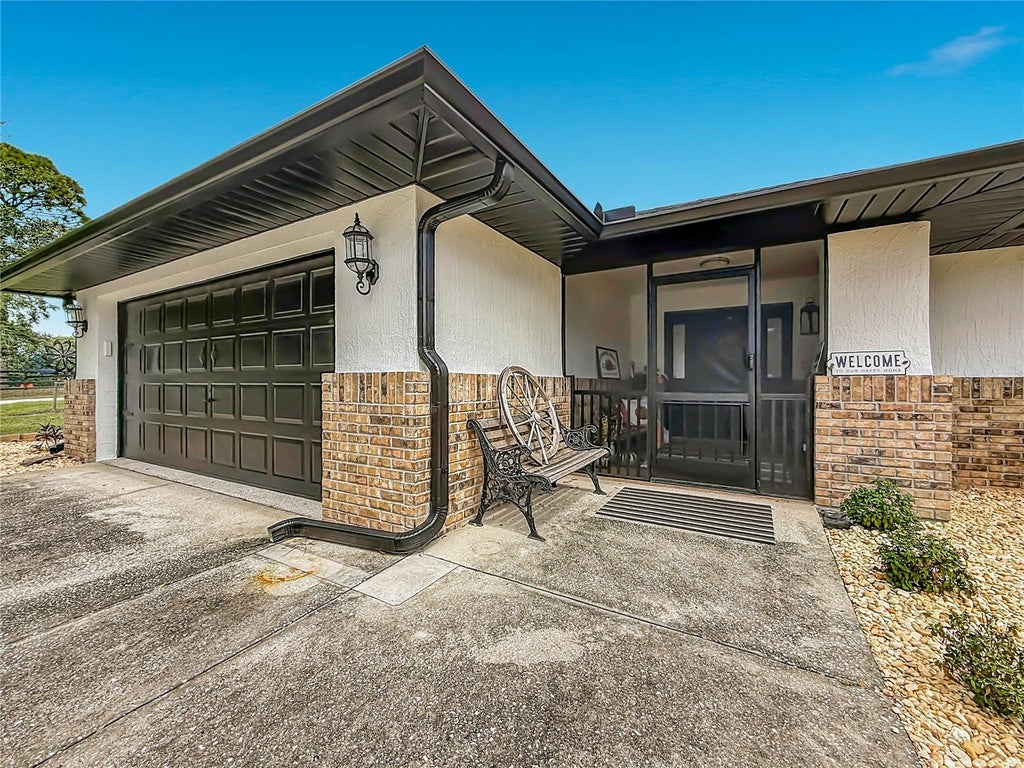 Photo of 9238 Tree Top Lane, Hudson, FL 34669 (MLS # W7889480)