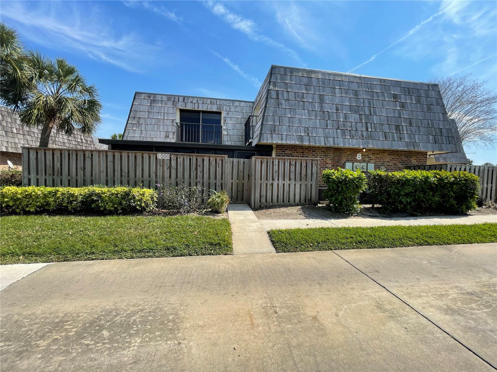 Beautifully updated 2/2/1 townhome in gated Royal Oak Estates. Property is manicured and immaculately maintained. This spacious 1,288 SF +/- home was fully updated in 2022 and includes 2 private covered parking spaces. The large enclosed lanai has big vinyl windows, as well as a separate A/C so you can relax there year-round. The first floor living area is open with sliding doors out to the lanai for more room and a flood of natural light. The kitchen is just the right size with granite counters, beautiful cabinets, and another set of sliders out to the lanai for easy entertaining and more light. There's a first-floor half bath and laundry room. Up the stairs, there are TWO primary / masters bedrooms each with an ensuite bathroom and private balcony to enjoy a summer night breeze or pull down the blackout shades and sleep till noon! Amenities include a community pool, fitness center, clubhouse and covered picnic/bbq area. Property is vacant and easy to see, just call for an appointment. All information is believed accurate and correct but not guaranteed or warranted and subject to change without notice.