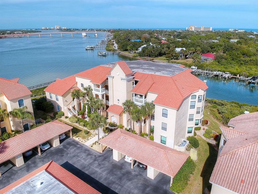DIRECTLY ON Callalisa Creekand the ICW in Bouchelle Island, this bright and cheerful 2 bedroom 2 bath 3rd floor unit boasts incredible water views where you can watch graceful marine life, and bask in warm coastal breezes.  With an option to be purchased completely furnished, this immaculate unit offers a desirable open floor plan with views of the water from nearly every room.  The updated kitchen features a beautiful modern backsplash, granite counter tops with expansive breakfast bar, and an easy to work in design.  The spacious master bedroom offers private access to the balcony and its bath boasts split sink and upgraded modern tile in the step-in shower. Other features include walk in closets, IN UNIT washer and dryer, new roof in 2019 and covered carport parking.  The community friendly association offers residents a lot to do! From kayaking/or canoeing on peaceful Callalisa Creek or taking part in a variety of community events at the clubhouse & the many other amenities that include, 2 heated pools, tennis court, shuffleboard, putt-putt golf, private boat ramp, river walk, and fishing pier. Also offered are Boat Slip Rentals and dry storage spots. Reserved owner parking space under carport conveys w/sale. Enjoy maintenance free living and convenient beachside location near to everything that NSB has to offer. Furniture is negotiable but not part of the sale price. ;LocationDescription: Condo ;Water: City