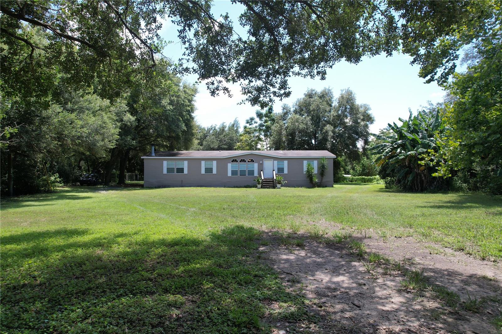 Charming 3-bedroom, 2-bath home nestled on a peaceful 2.36-acre lot (324x318). Thoughtfully built with quality craftsmanship, this home offers a spacious 15x24 covered deck for relaxing outdoor living. Enjoy the tranquility and privacy provided by trees surrounding three sides of the property.